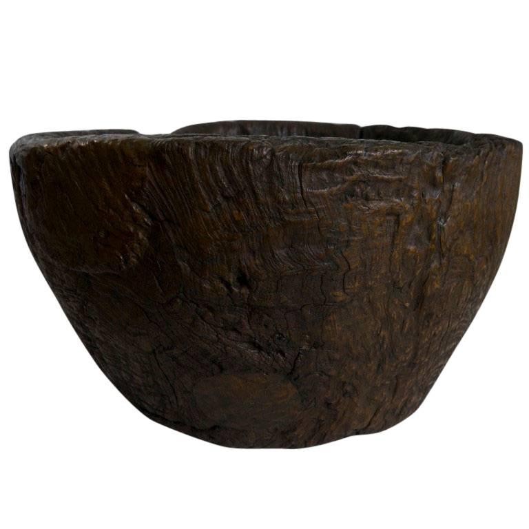 Antique granary mortar teak burl hardwood bowl from Java, Indonesia with a patina of age and wear.