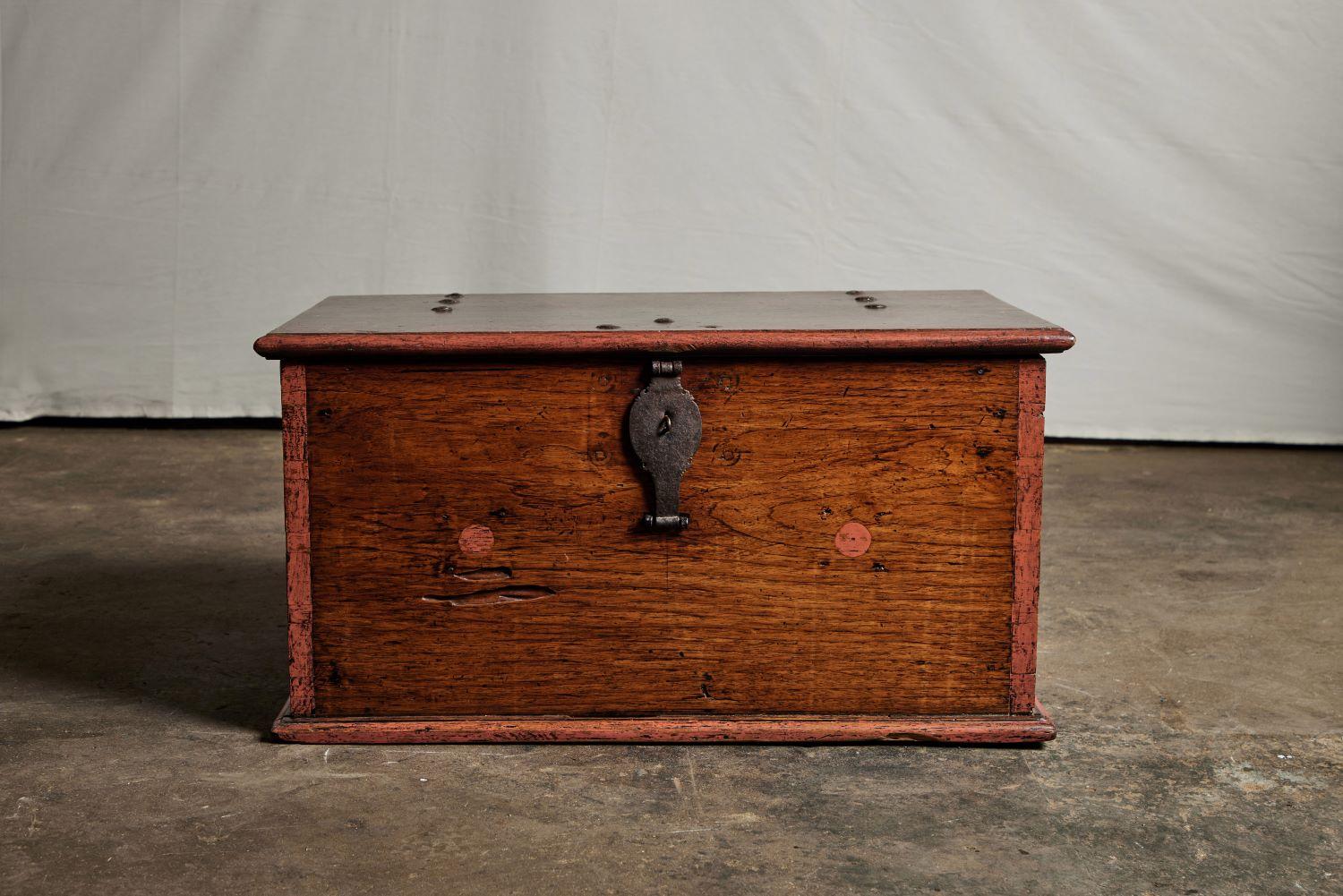 A mid-19th century Indonesian teak trunk with painted detailing.