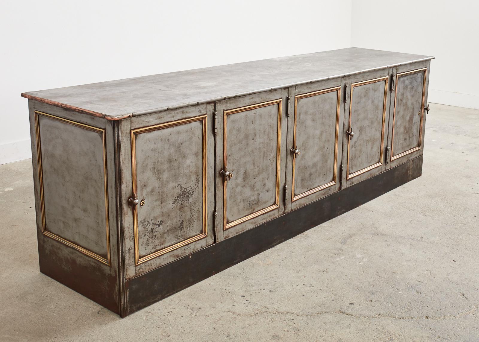 Monumental late 19th century American industrial style steel safe cabinet having bronze mounted doors. Fantastic design from an upscale east coast department store that could serve as a sideboard, server, buffet, credenza, or console. Very heavy and