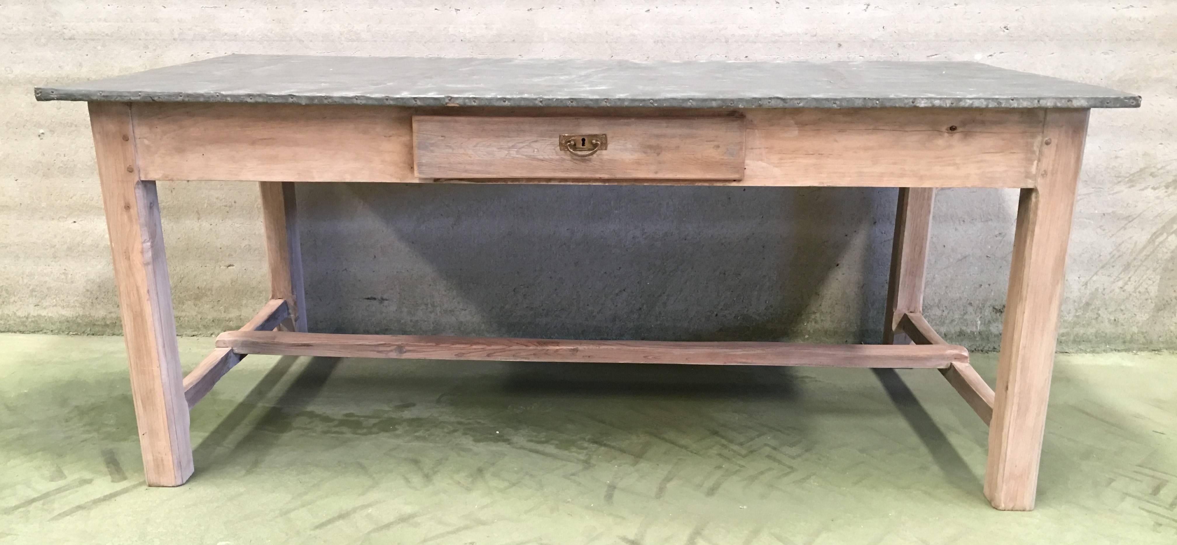 Great piece of French vernacular work table, from a shop, home or studio. Now for a kitchen, living room loft or dining room serving table. Old zinc beautifully patinated. Wood had bleached and waxed. Table base with touches of ornamentation.