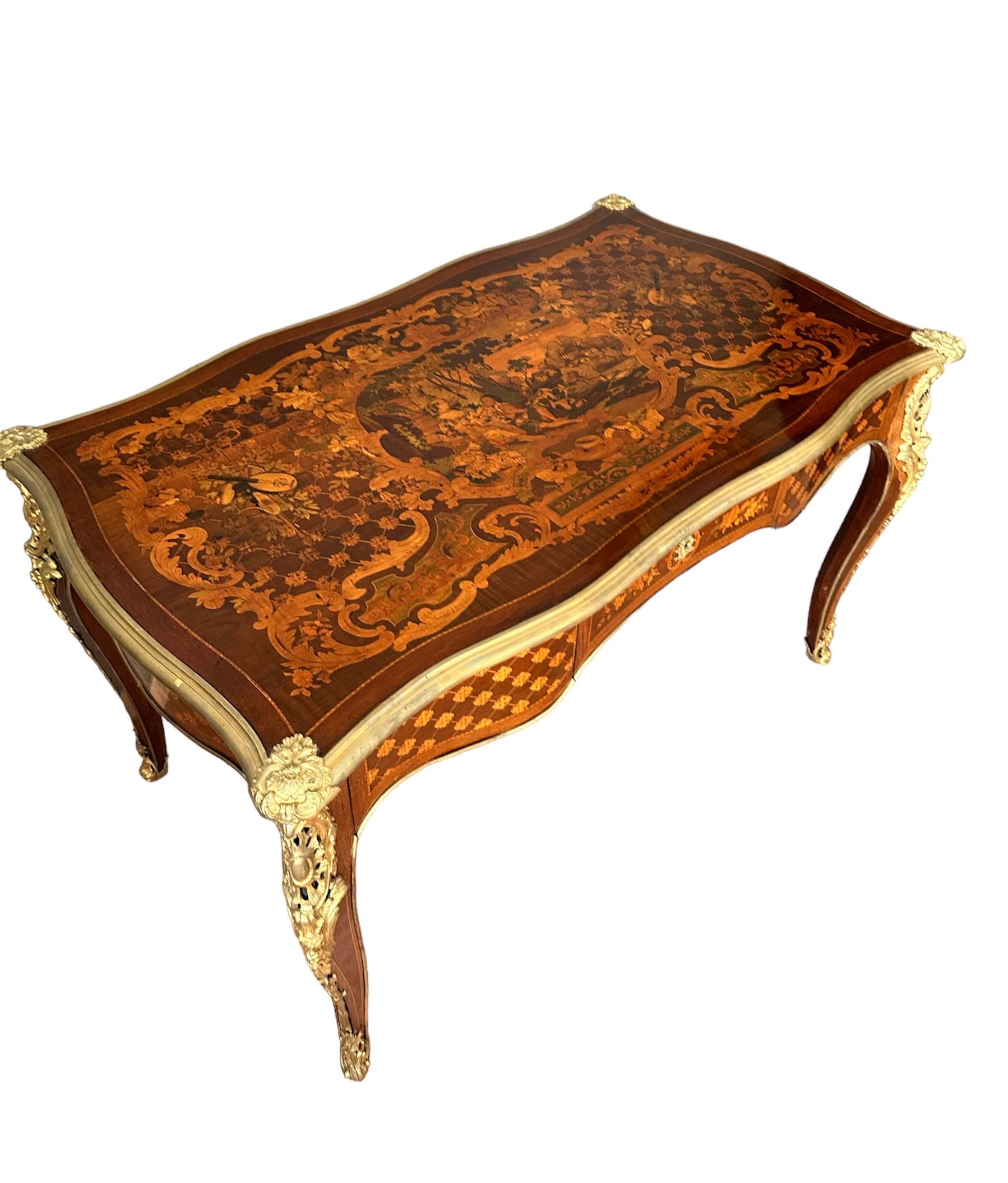 Elegant center desk, made of exotic wood and inlaid with various precious woods.

Entirely inlaid in every minimum detail, painstaking work made by a great 19th century cabinetmaker, Paul Sormani. The desk top has a crazy inlay that almost looks