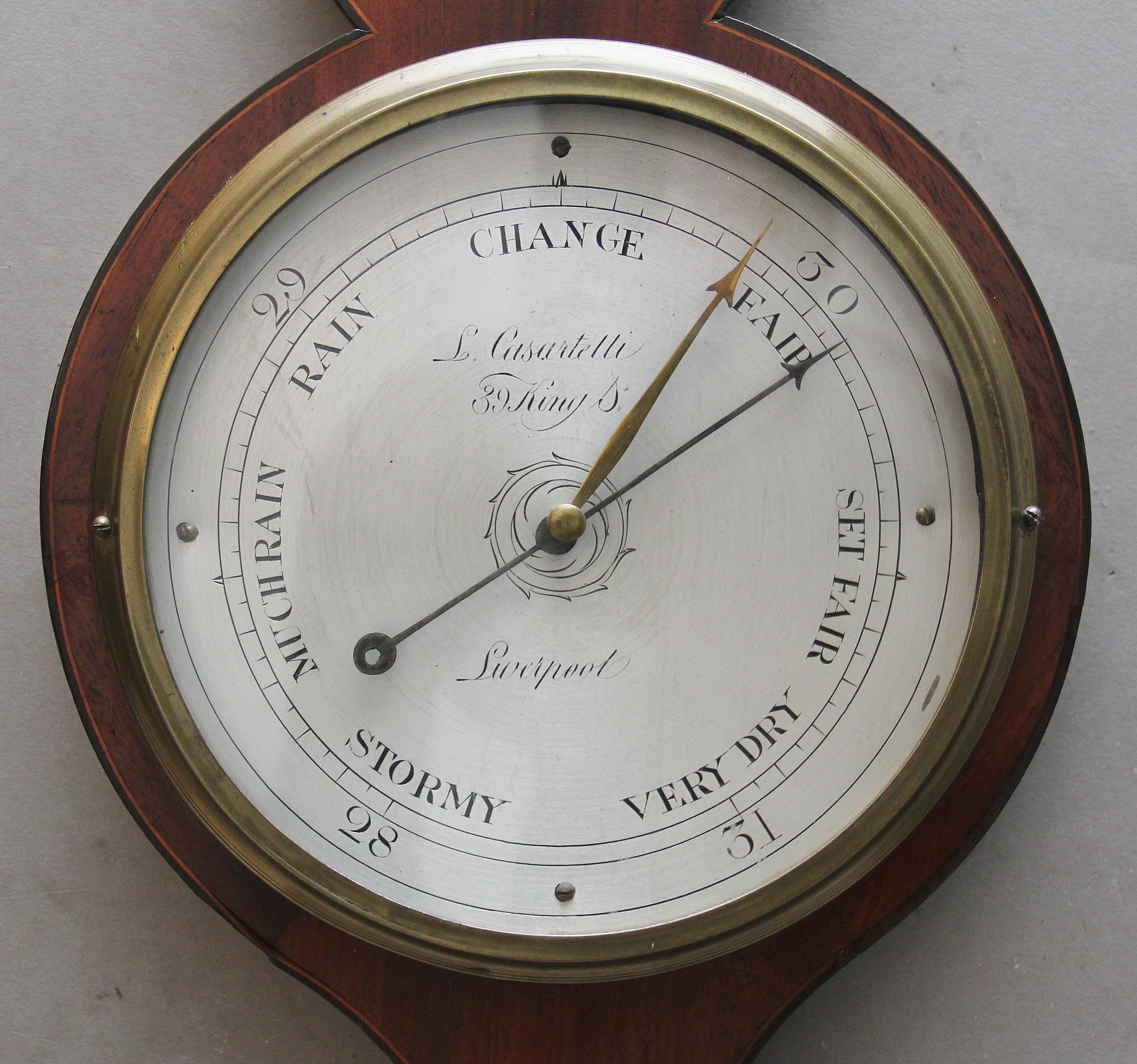 19th century inlaid mahogany banjo barometer by L Casatelli of Liverpool, having an architectural top with a central brass finial, the shaped mahogany case having decorative shell inlay and boxwood stringing, large circular engraved silvered dial