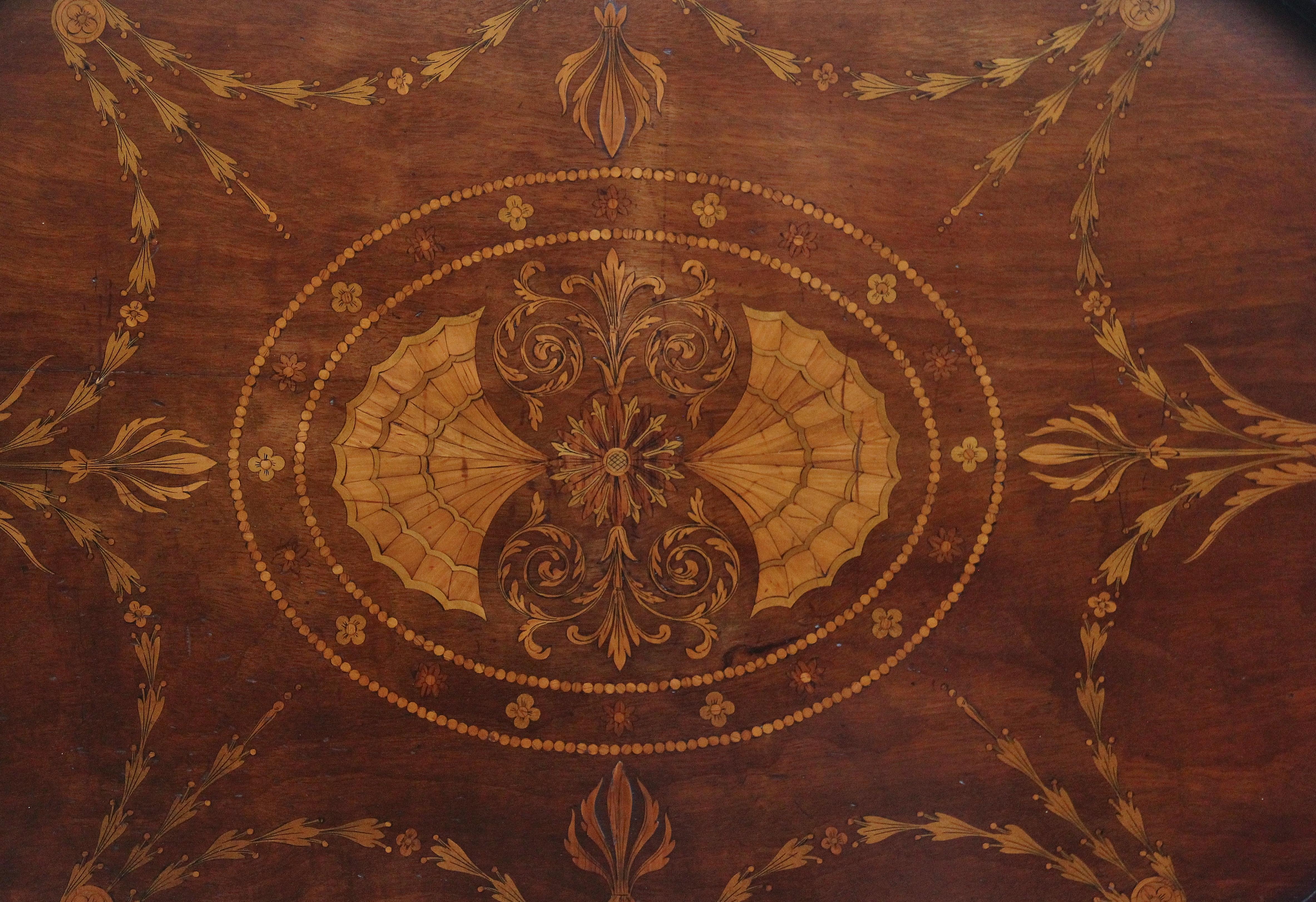 A lovely quality 19th Century inlaid mahogany tray of oval form, having a shaped gallery edge with brass carrying handles either end, having lovely intricate inlay incorporating various patterns and floral decoration, the inlay is fabulous and all