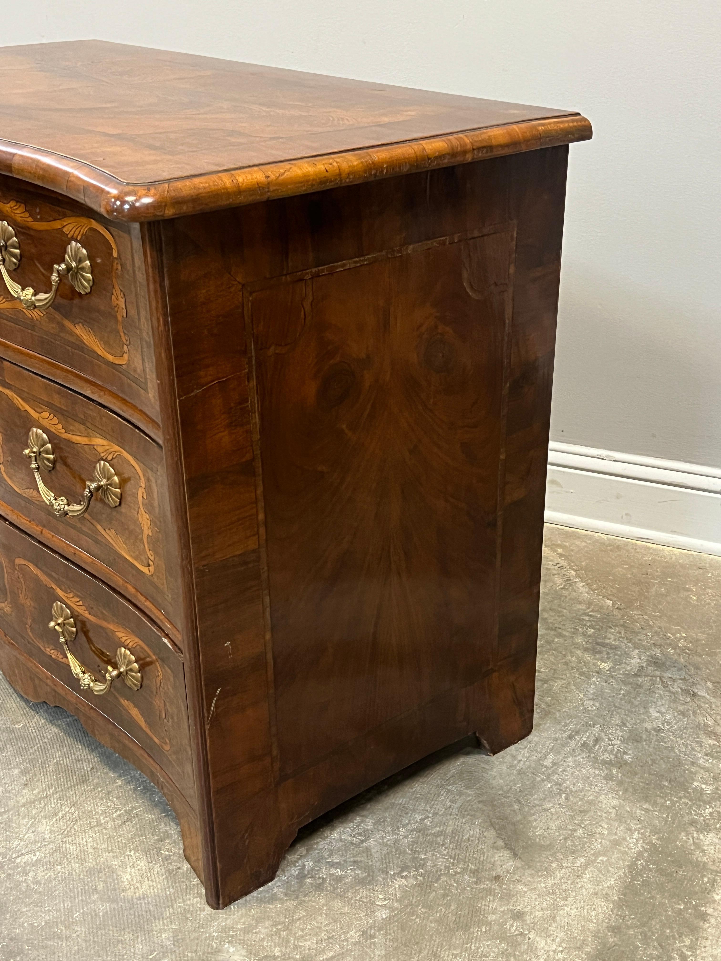 Beautifully hand made French commode in walnut with contrasting king wood marquetry designs and inlaid lozenge designs on drawers. Drawers are hand made and exhibit finer hand cut bevels. The original back is in pine and carefully beveled and