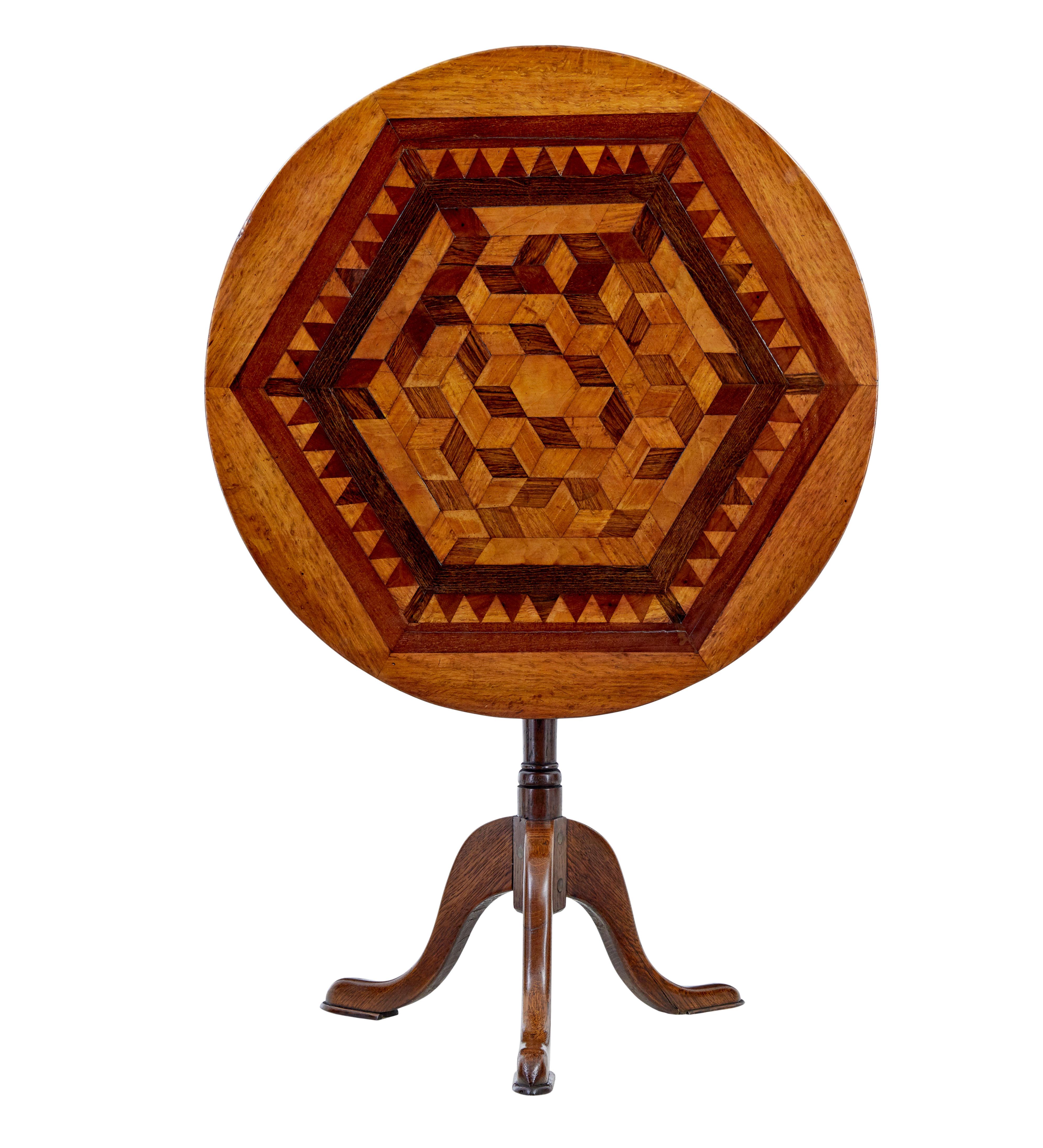19th century inlaid oak round occasional table circa 1880.

Good quality round tilt top table, ideal for many uses around the home.

Circular top inlaid with a geometric pattern, featuring exotic woods such as walnut and tulp.  Raised on a turned