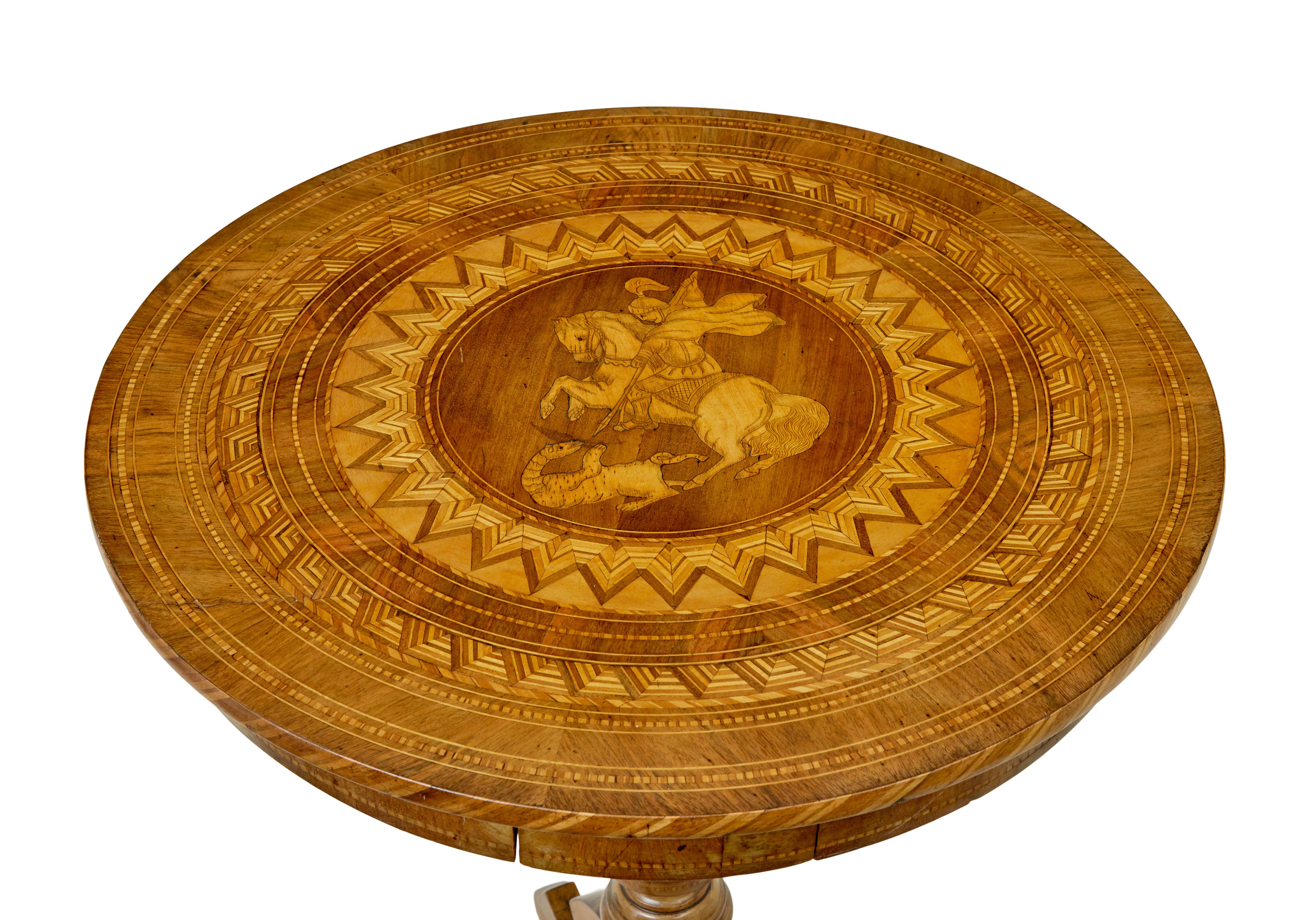 19th century inlaid round sorrento table circa 1890.

Good quality circular Italian sorrento occasional table, featuring a mounted figure slaying a mythical animal, quite possibly george and the dragon.  Circular top with the main inlaid center