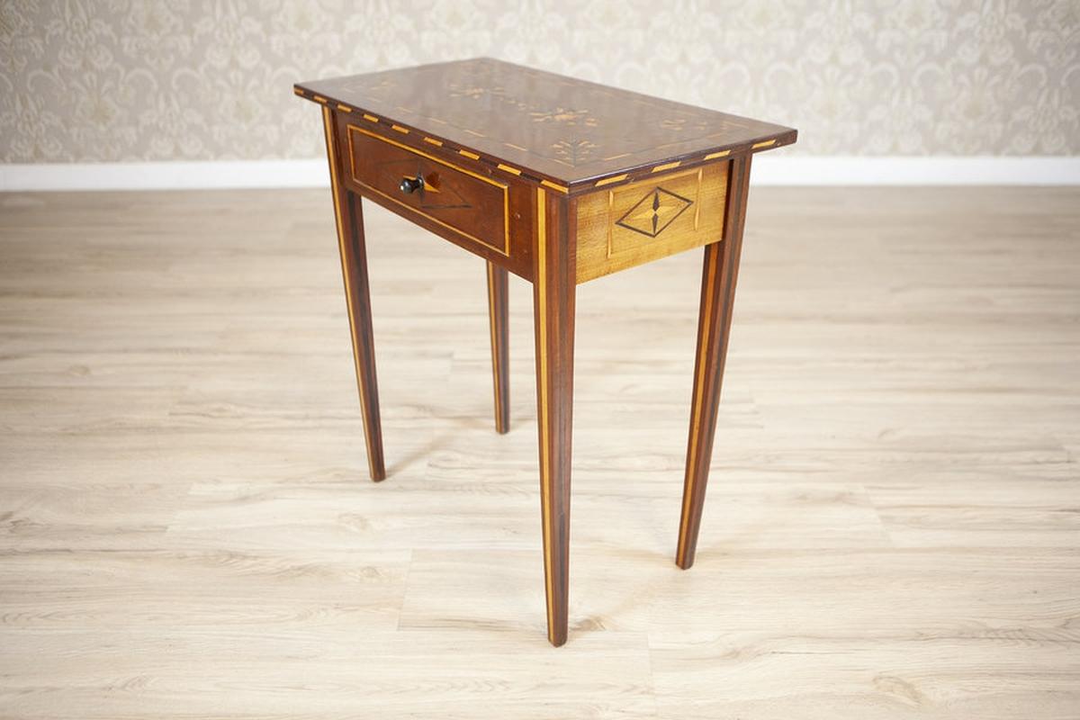 Inlaid Walnut Side Table, Late 19th Century

This beautifully proportioned, late 19th-century side table offers an elegant fusion of form and function. Its slim rectangular silhouette is supported by four straight legs, lending a refined simplicity