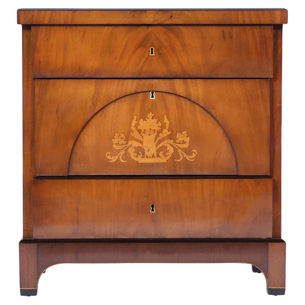 An extraordinary Antique Chest of Drawers handcrafted out of mahogany with inlaid veneers and features beautiful walnut and ebonized color combination with a newly lacquered finish. The dresser also has a wooden top with an ebonized trim, three