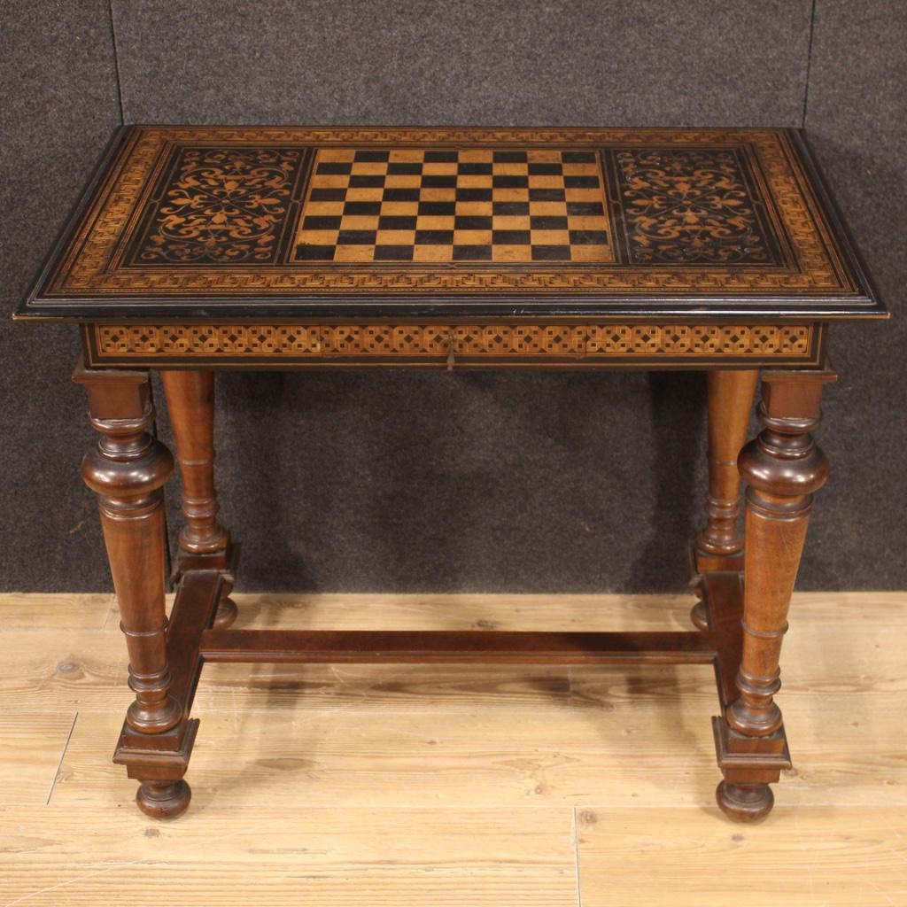 French game table from the late 19th century. Furniture of great character and quality with richly inlaid top with geometric and Renaissance decoration with central chessboard (see photo). 