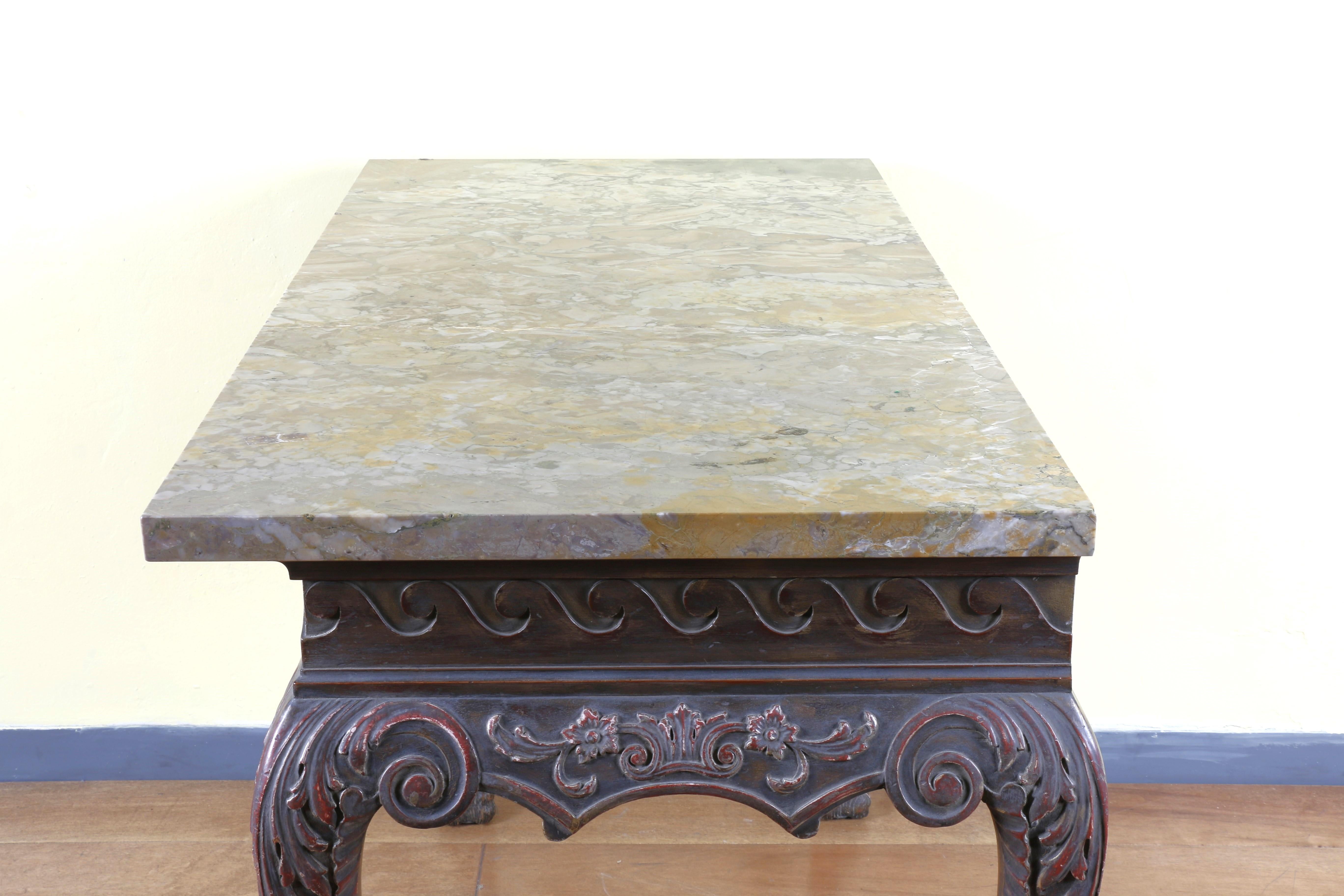 Spectacular 19th century Irish Chippendale style mahogany accent console table with beautiful carving. Made of mahogany wood and with a marble top. Super heavy and sturdy. A little chip in the marble