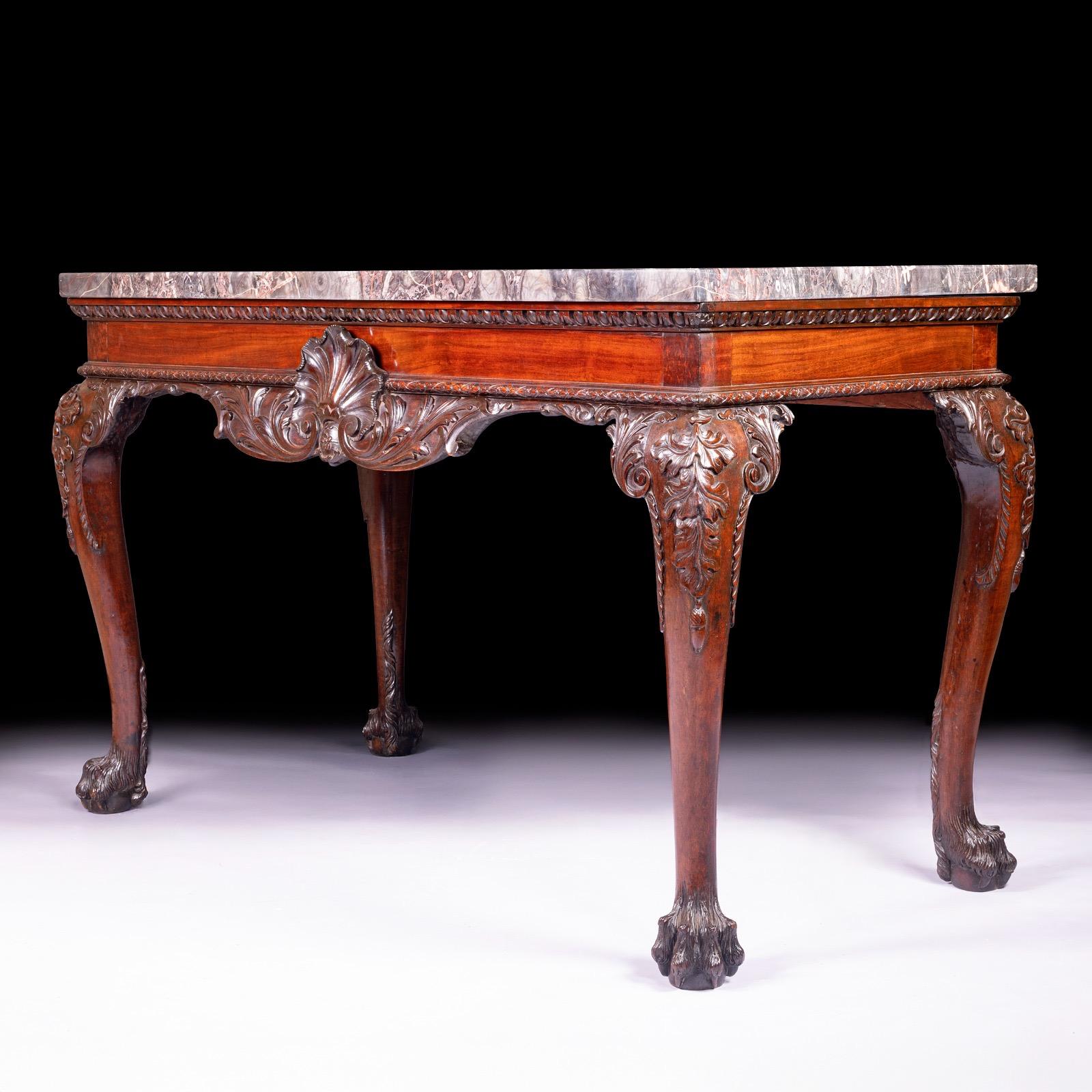 A superb 19th century George III style console / side table. The rectangular marble top above a shaped punched apron centered by a Scallop and flanking foliate scroll work and similar sides, the cabriole acanthus carved legs headed by acanthus leaf