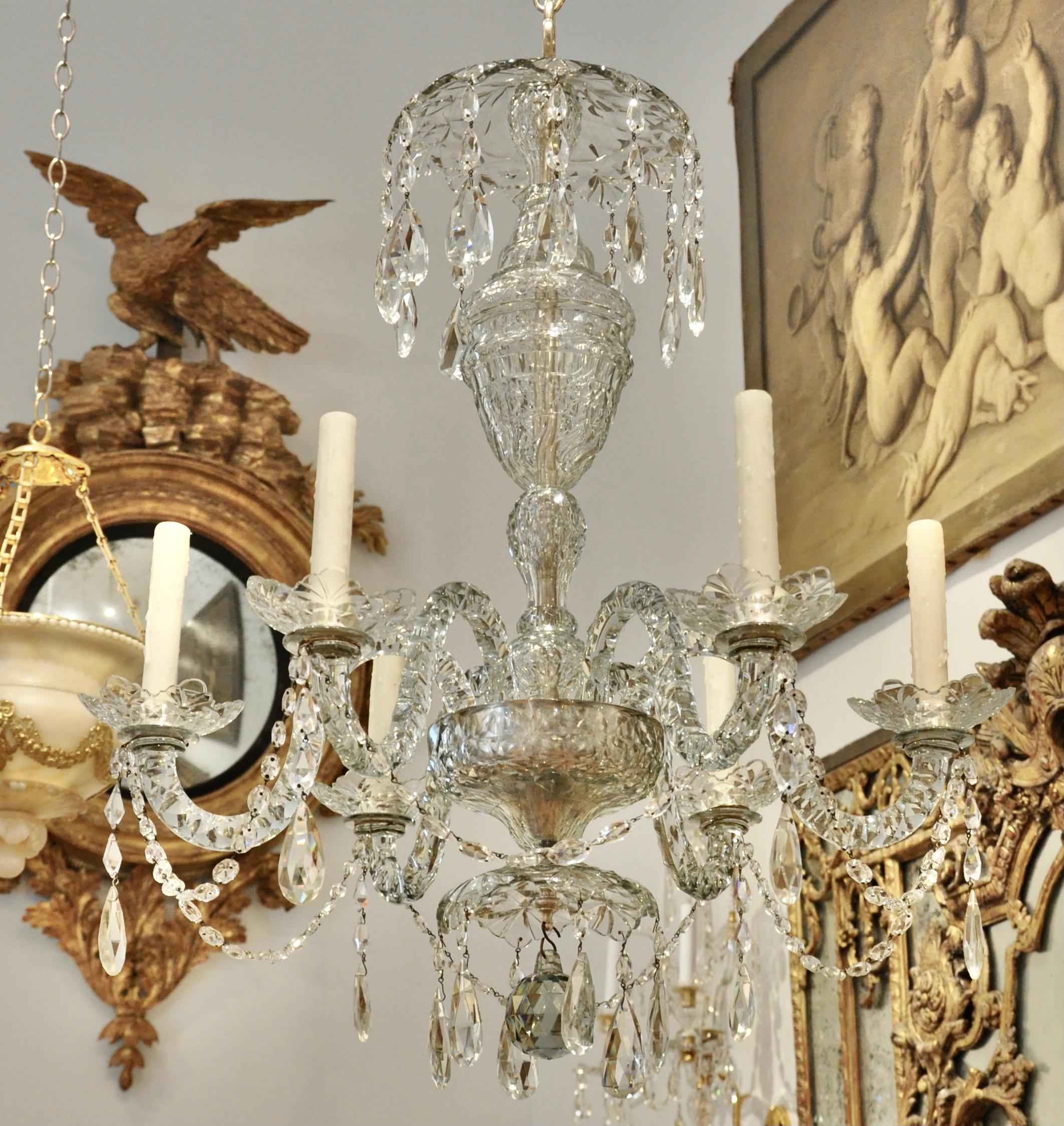 19th century Irish Georgian style hand cut crystal chandelier. Six arms issuing from a cut crystal dish. Urn shaped shaft and canopy. All original throughout. Silvered mounts.

--Will be French wired to US Standards at customer's request (about