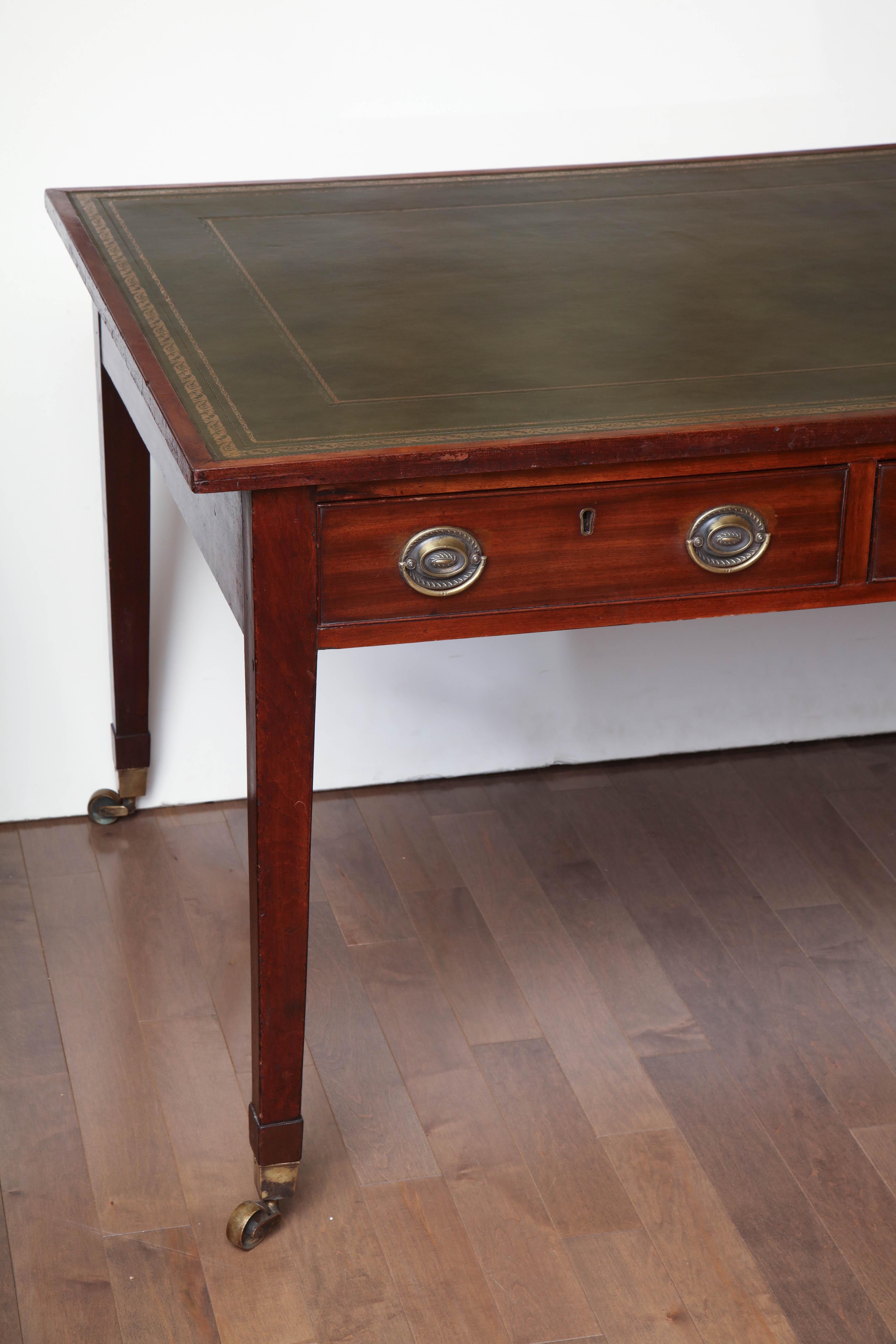19th century Irish, mahogany and leather topped partners desk with a center drawer fitment.
