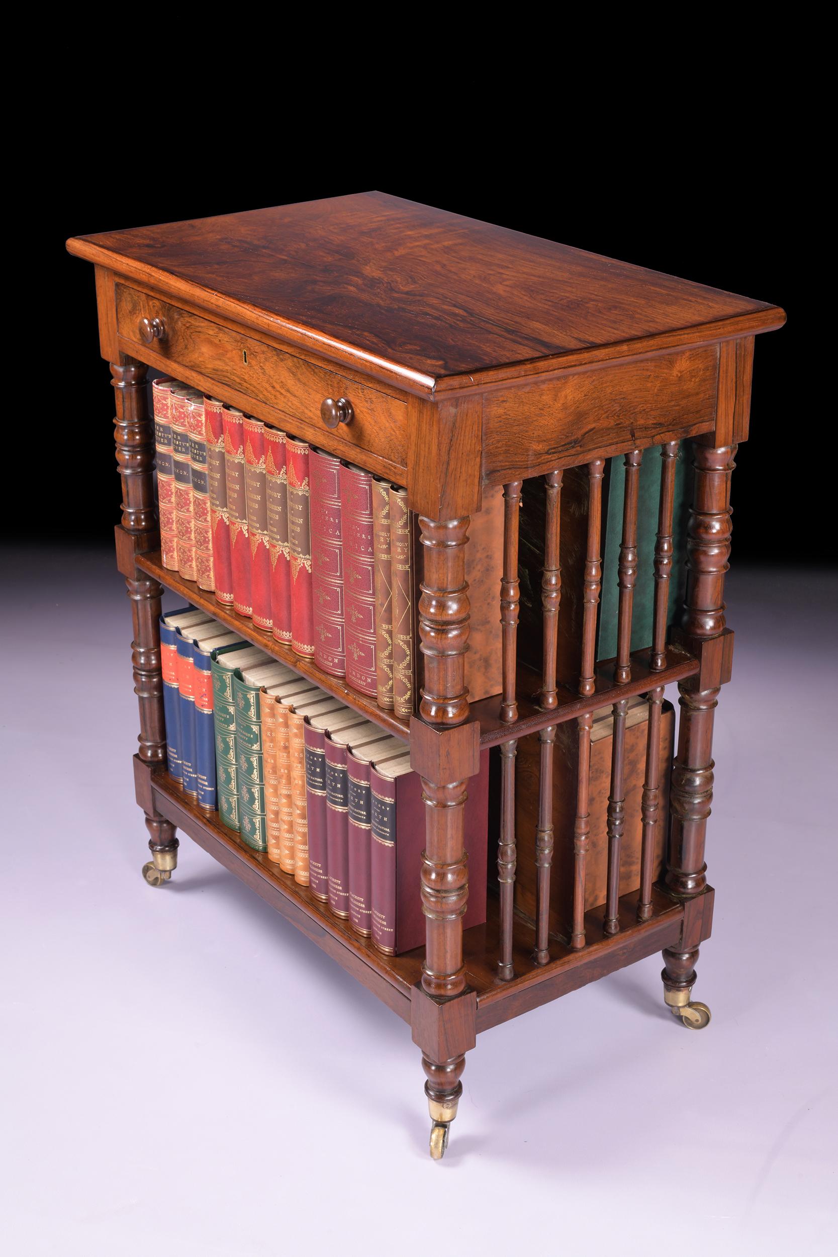 A stunning Irish Regency rosewood free standing bookcase attributed to Williams & Gibton of Dublin, the single frieze drawer above two shelves between ring turned uprights with spindle ends on its original castors.

Circa