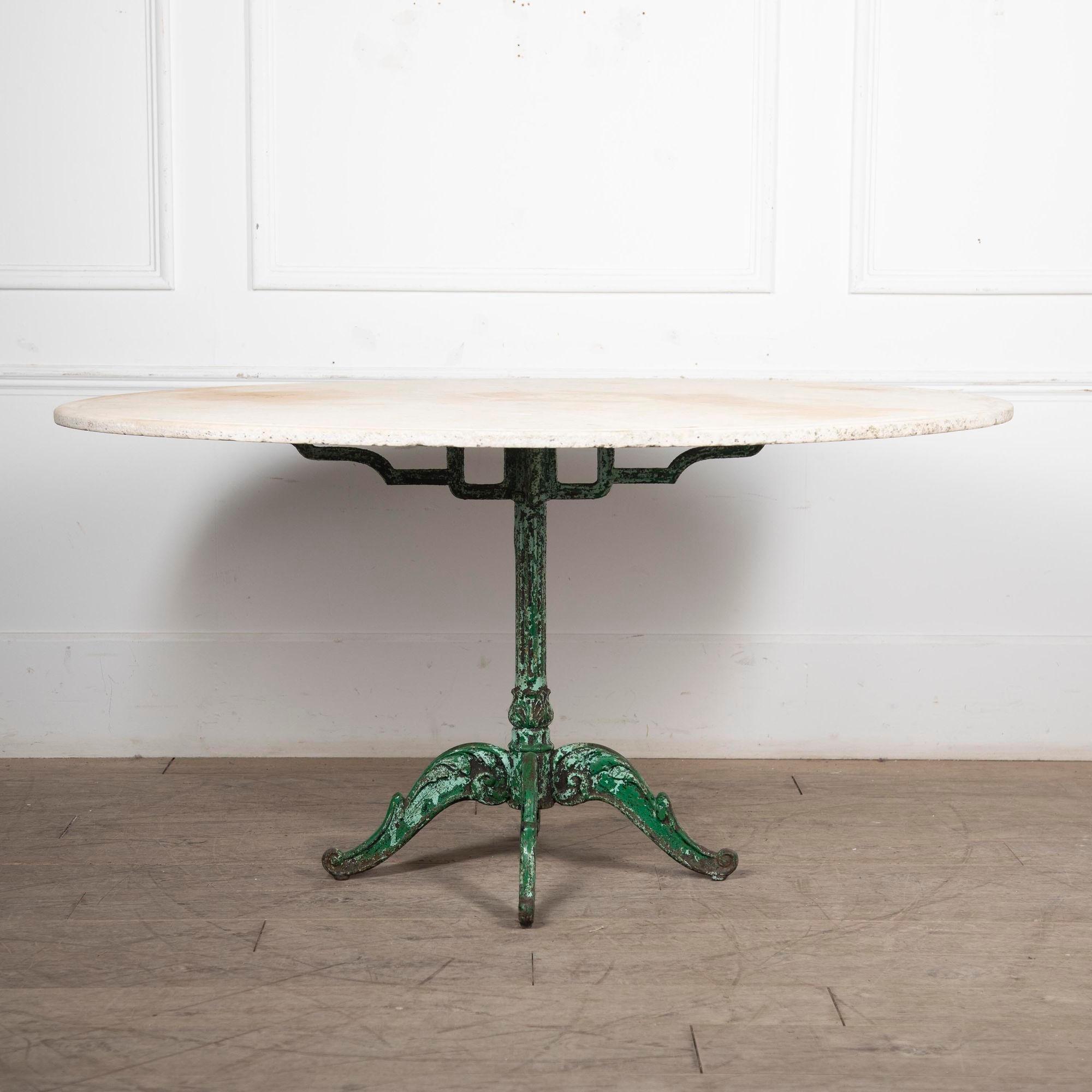 Wonderful scale late 19th century iron-based garden or conservatory table with a beautifully weathered old marble top.
The base of the table is in scraped old layers of pale and dark green paint.
