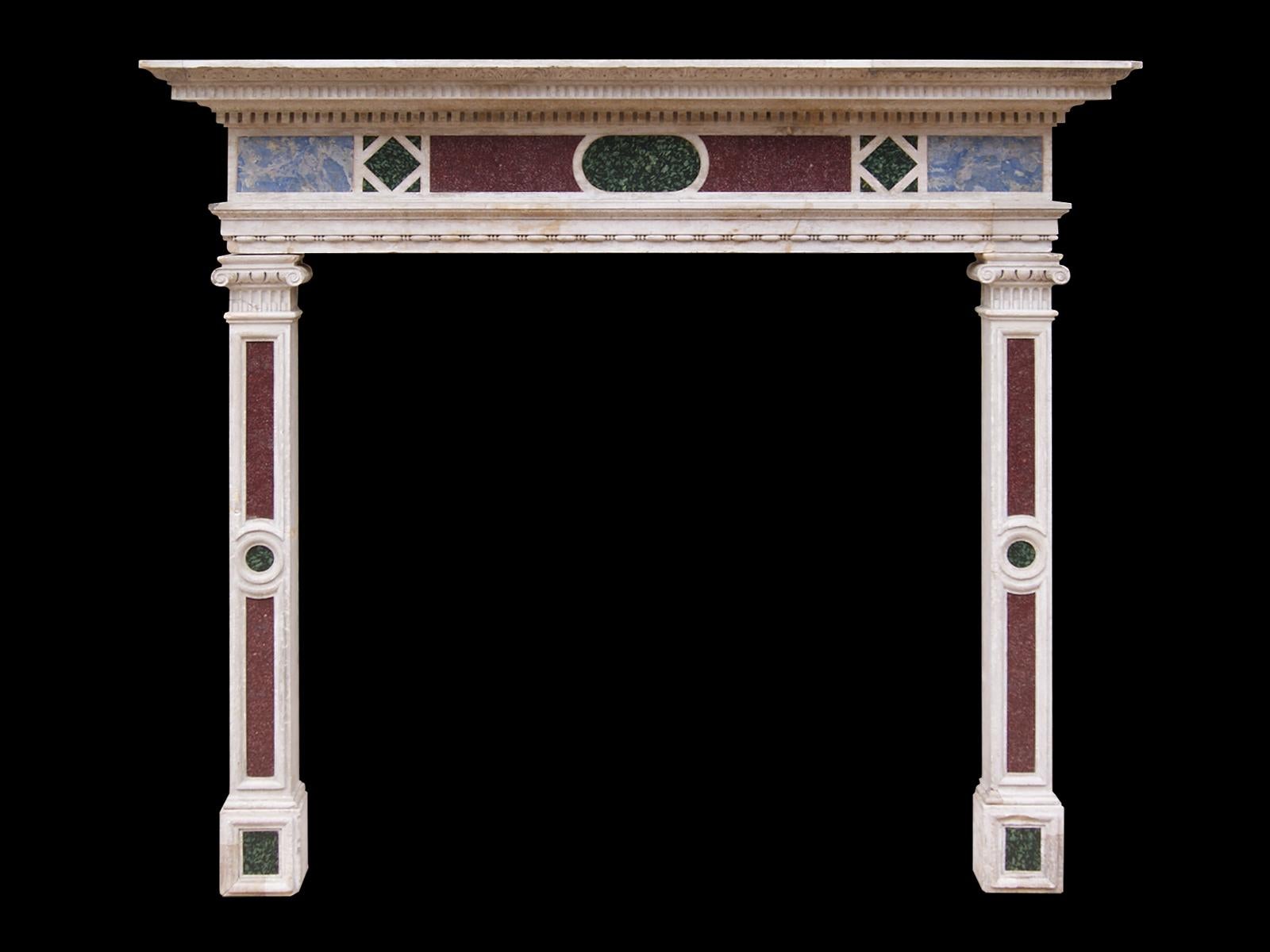 An Italianate style 19th century fireplace carved in Istrian stone with semi-precious inlaid marble frieze panels of Egyptian Imperial red porphyry, ancient green Peloponnesian Porphyry and Lazurite, supported on similarly panelled jambs. The jambs