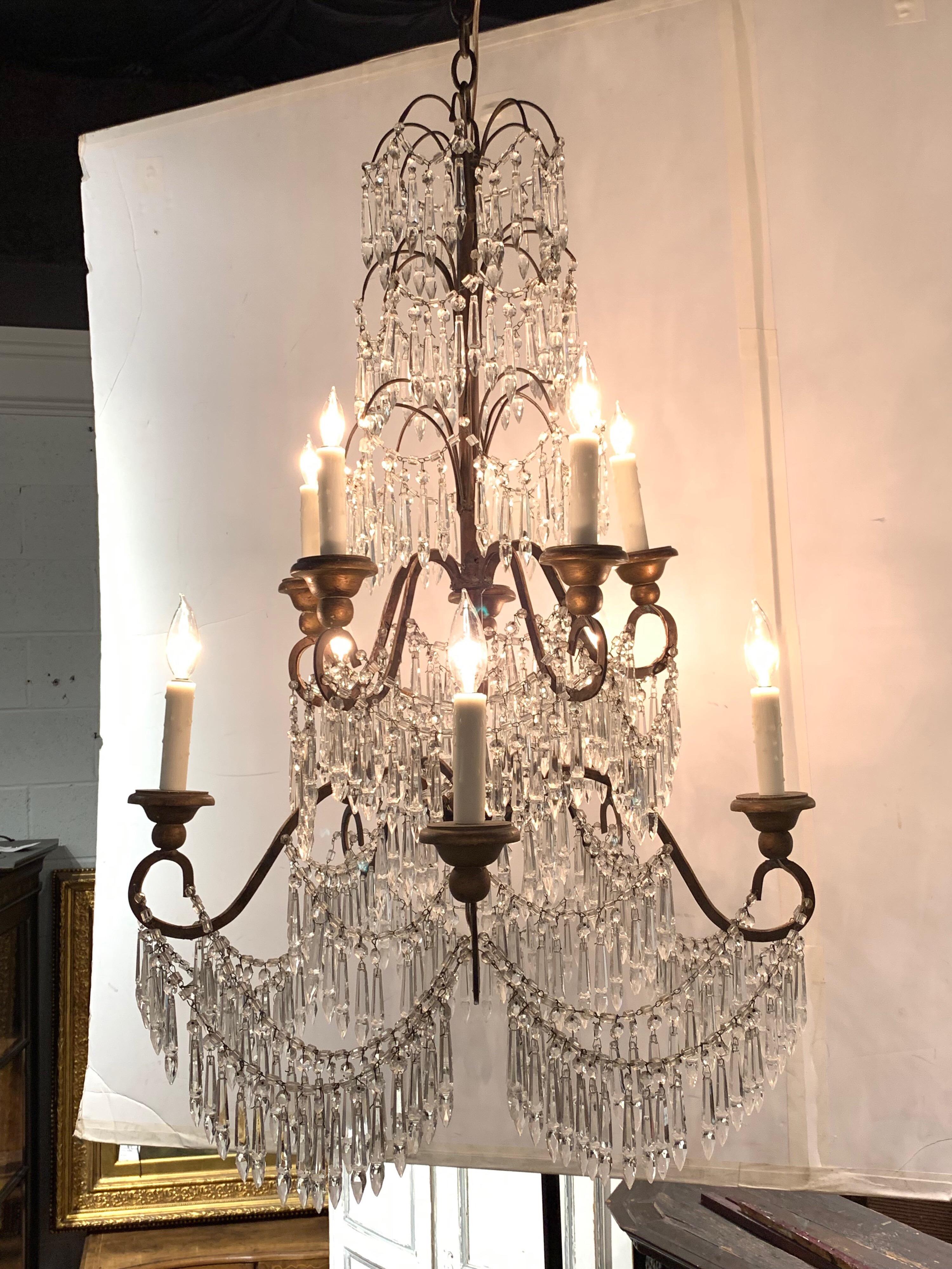 Gorgeous 19th century Italian crystal chandelier with 10 lights and beautiful cascading prisms.
Makes a lovely statement in a fine home.