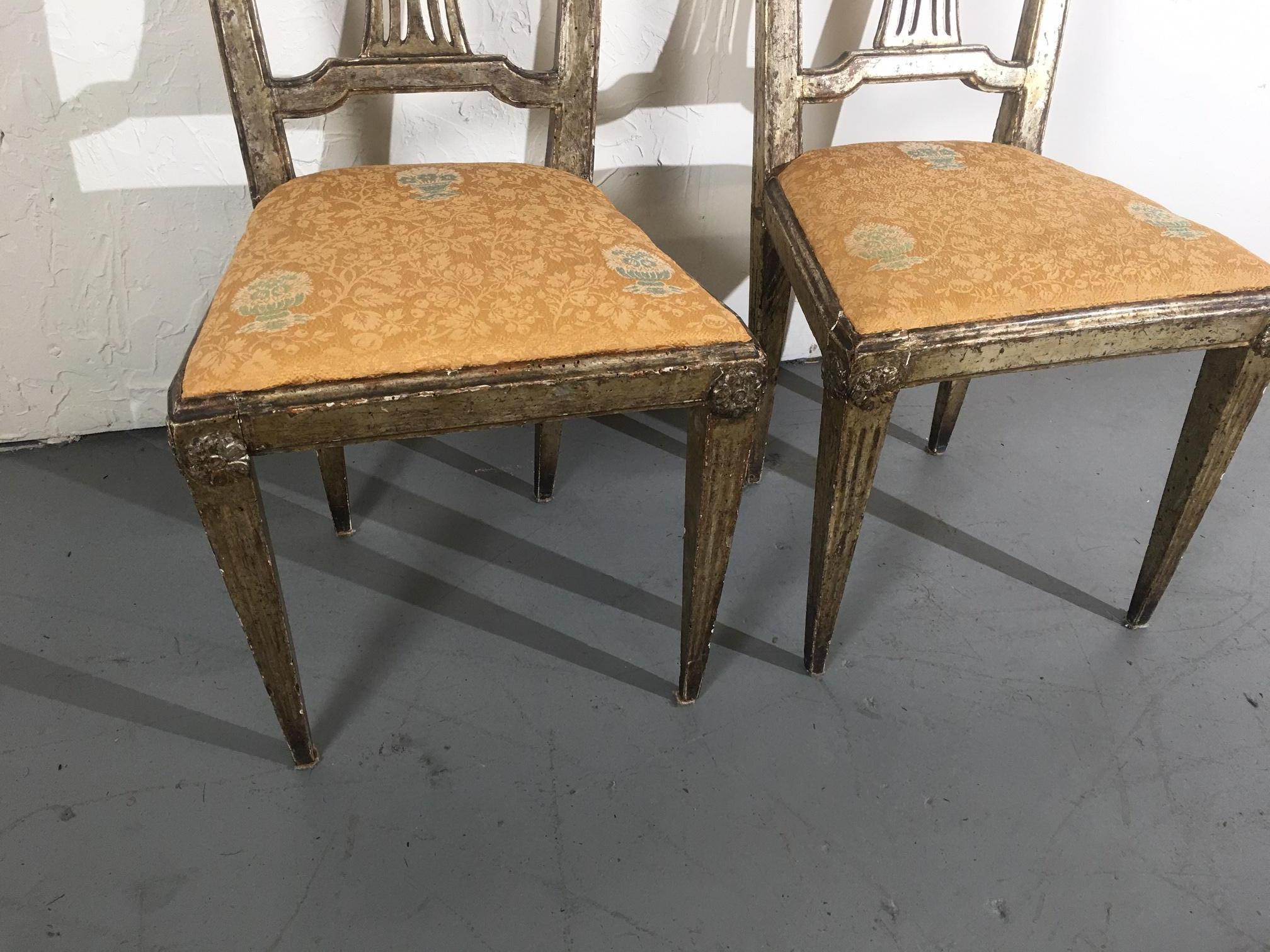 Pair of silver leaf Italian accent chairs.