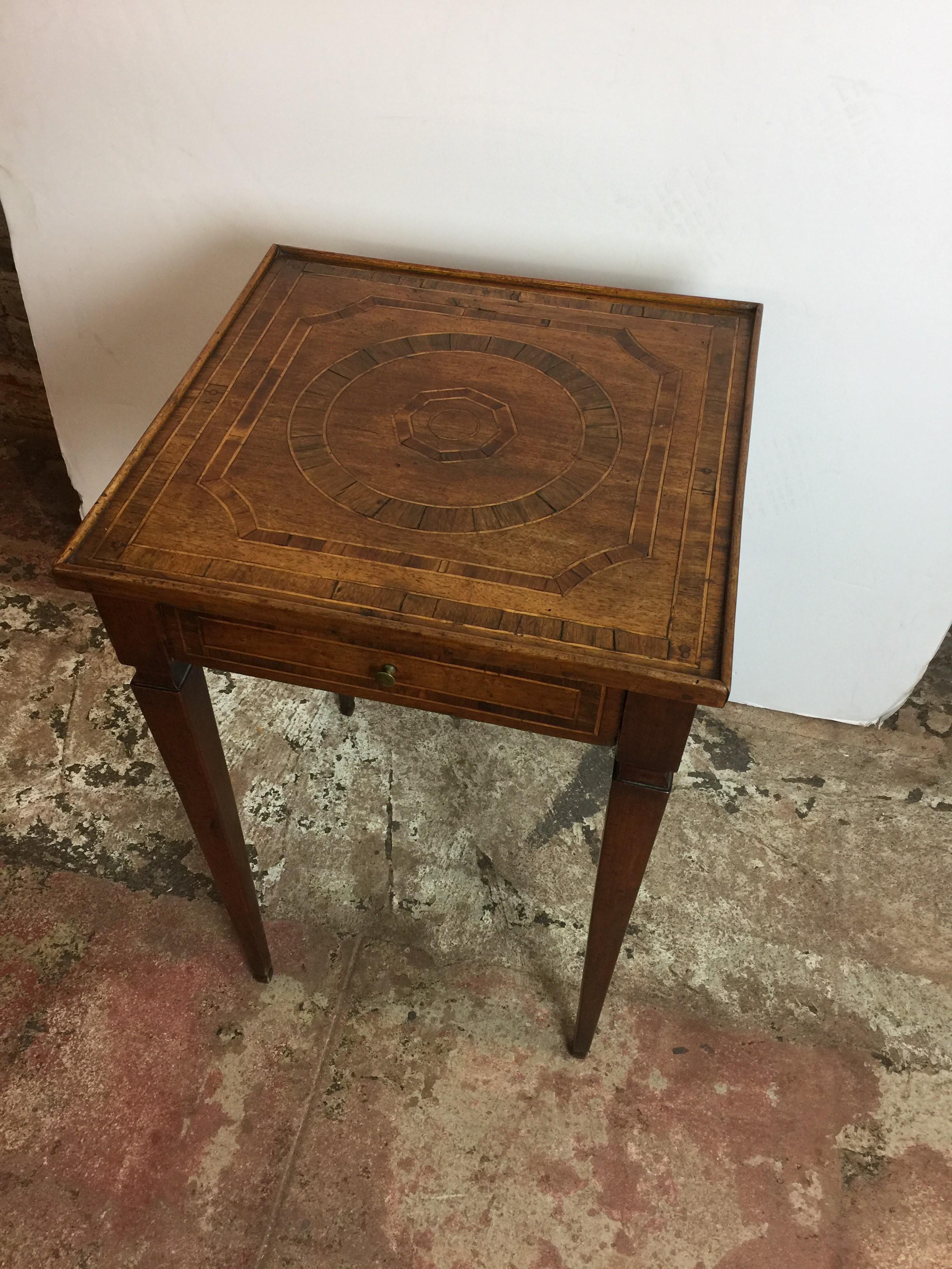 19th century marquetry accent table with a single drawer.