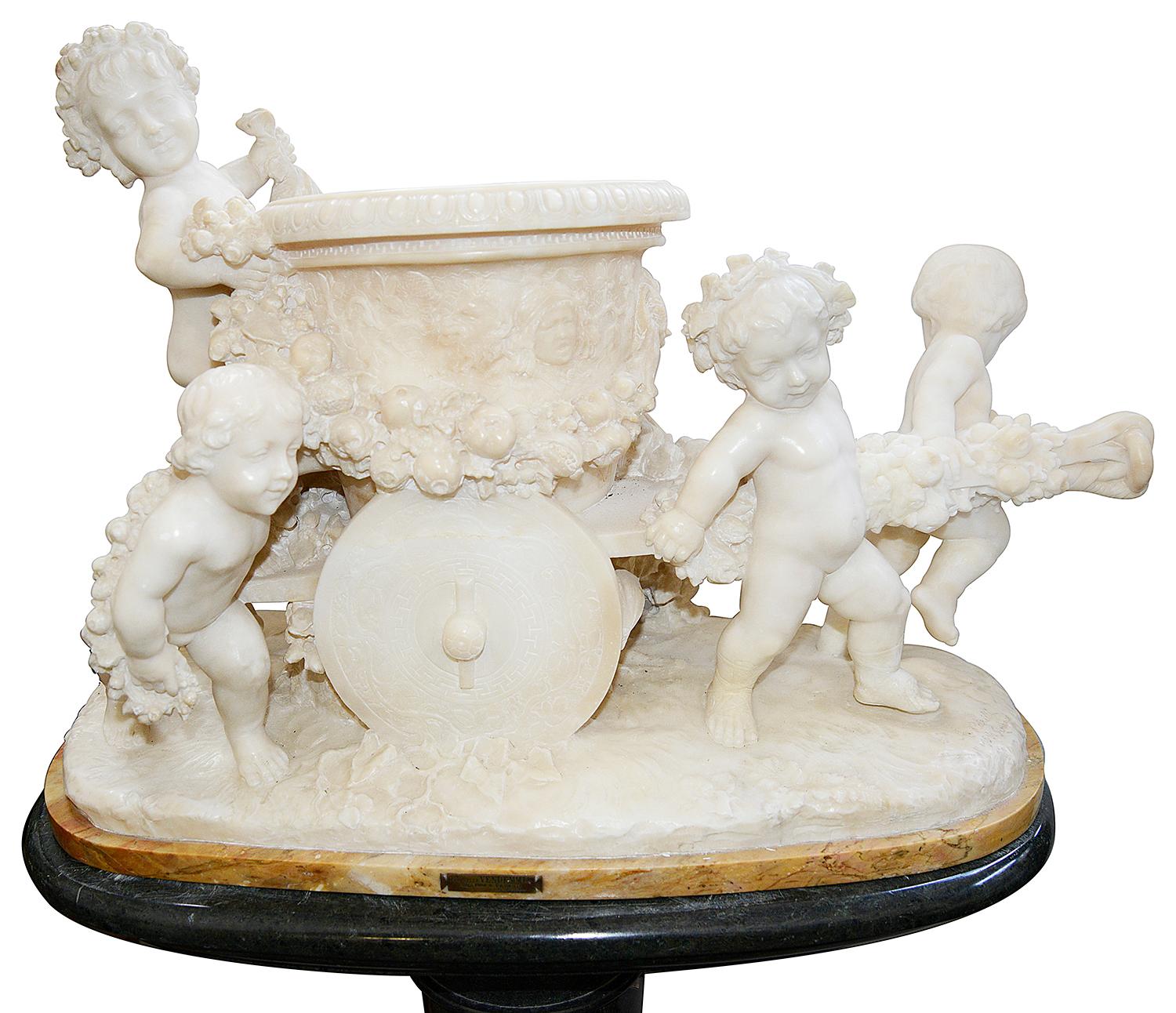 This enchanting 19th century Italian carved Alabaster group of four putti playing whilst pushing and pulling a wooden cart, entitled; 'From the harvest' 
By Prof; A. Petrill, Firenze.
Raised on a contemporary green marble pedestal fluted pedestal.