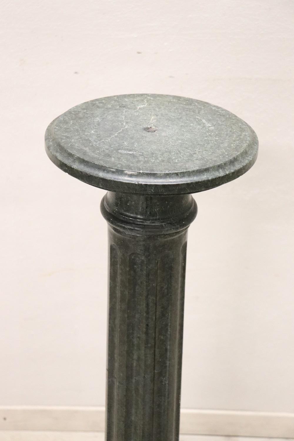This spectacular late 19th century antique column in made of precious green Italian marble from the Alps. The body is sculpted with grooves. Its dimensions allow you to exhibit sculptures or even large vases such as busts. Very small defects in the