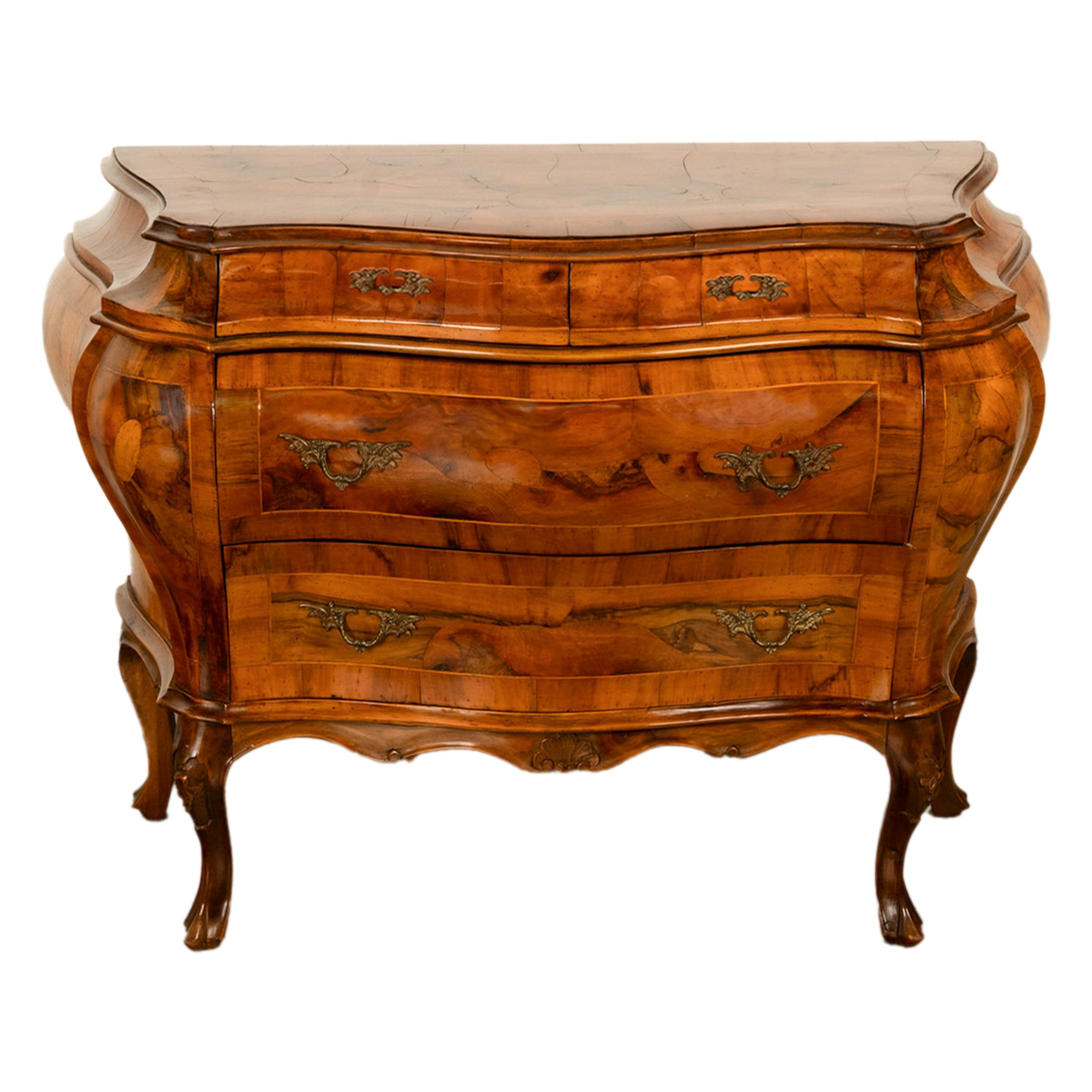 A good antique inlaid Venitian walnut bombe shaped commode/chest of drawers, Rococo/Louis XV style, Italy, circa 1880.  
The chest is made from finely figured walnut and inlaid with fruitwood stringing, the bombe shaped chest with two short drawers