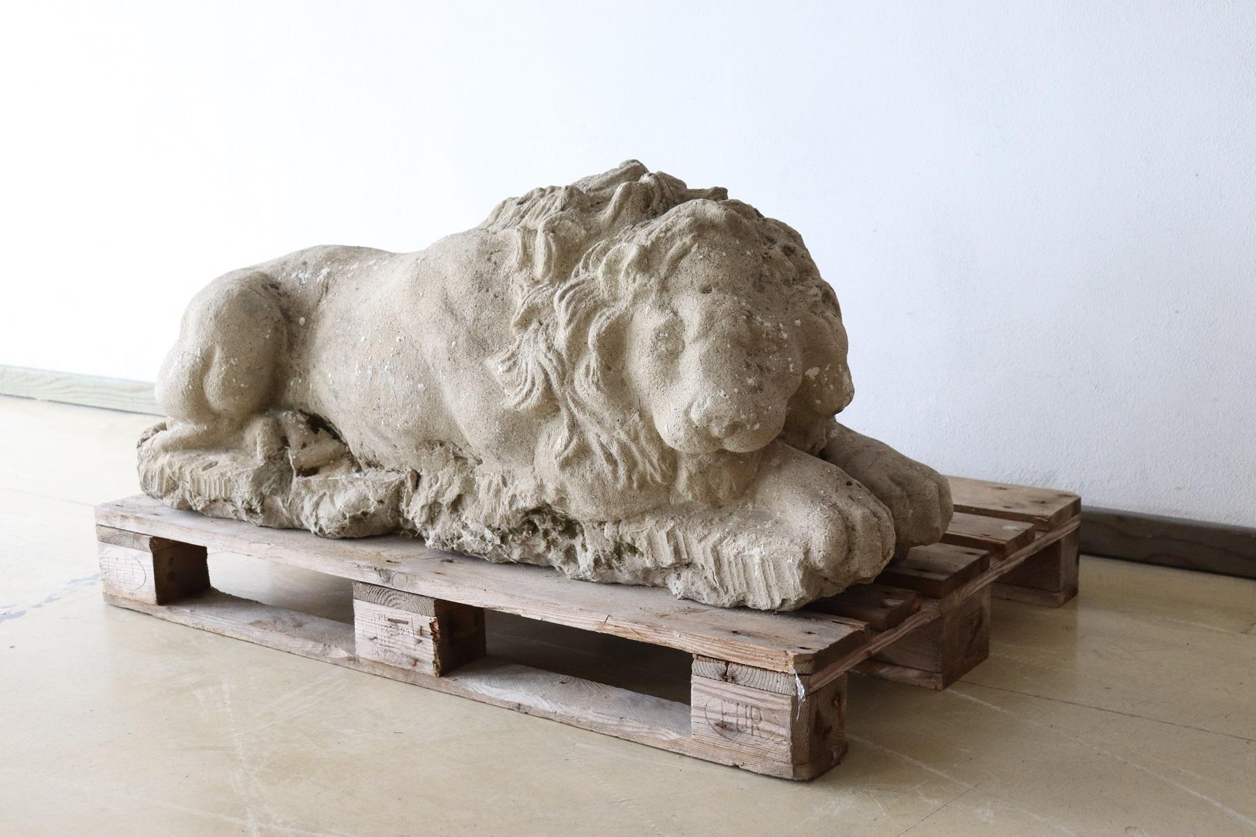 Refined lion sculpture in hand carved stone dating 1780s. Performed with great artistic skill to note the details of the lion's mane and muscles. This lion is represented in all its grandeur in a moment of tranquility. Proven Italian private