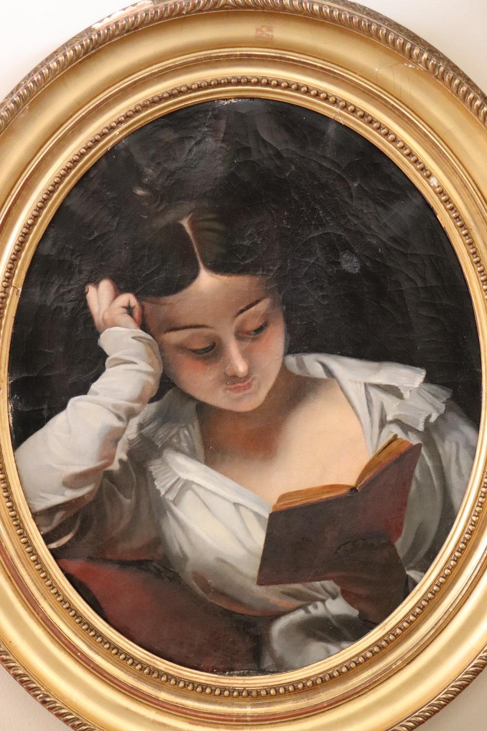 Beautiful antique Italian oil painting on canvas 1850s. Oval Portrait of a young girl reading. High artistic quality note the perfection in portraying the girl's face completely immersed in reading her book. The sweet and clean face reflects the