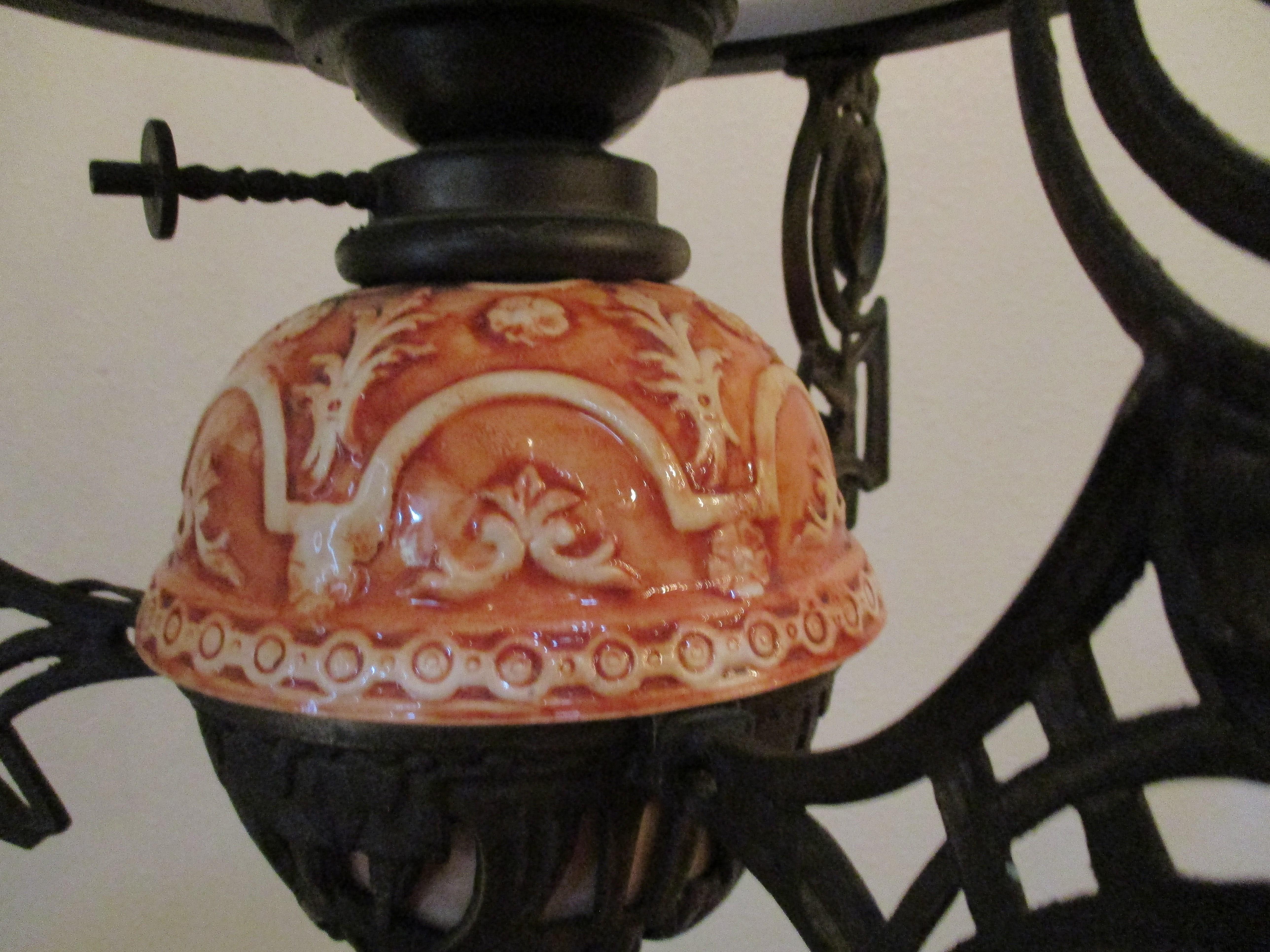 Originally this 19th century Italian Art Nouveau lantern was gas burning. It was modified for electricity in the 1960s. It's a one of a kind Italian orange-glazed ceramic chandelier.