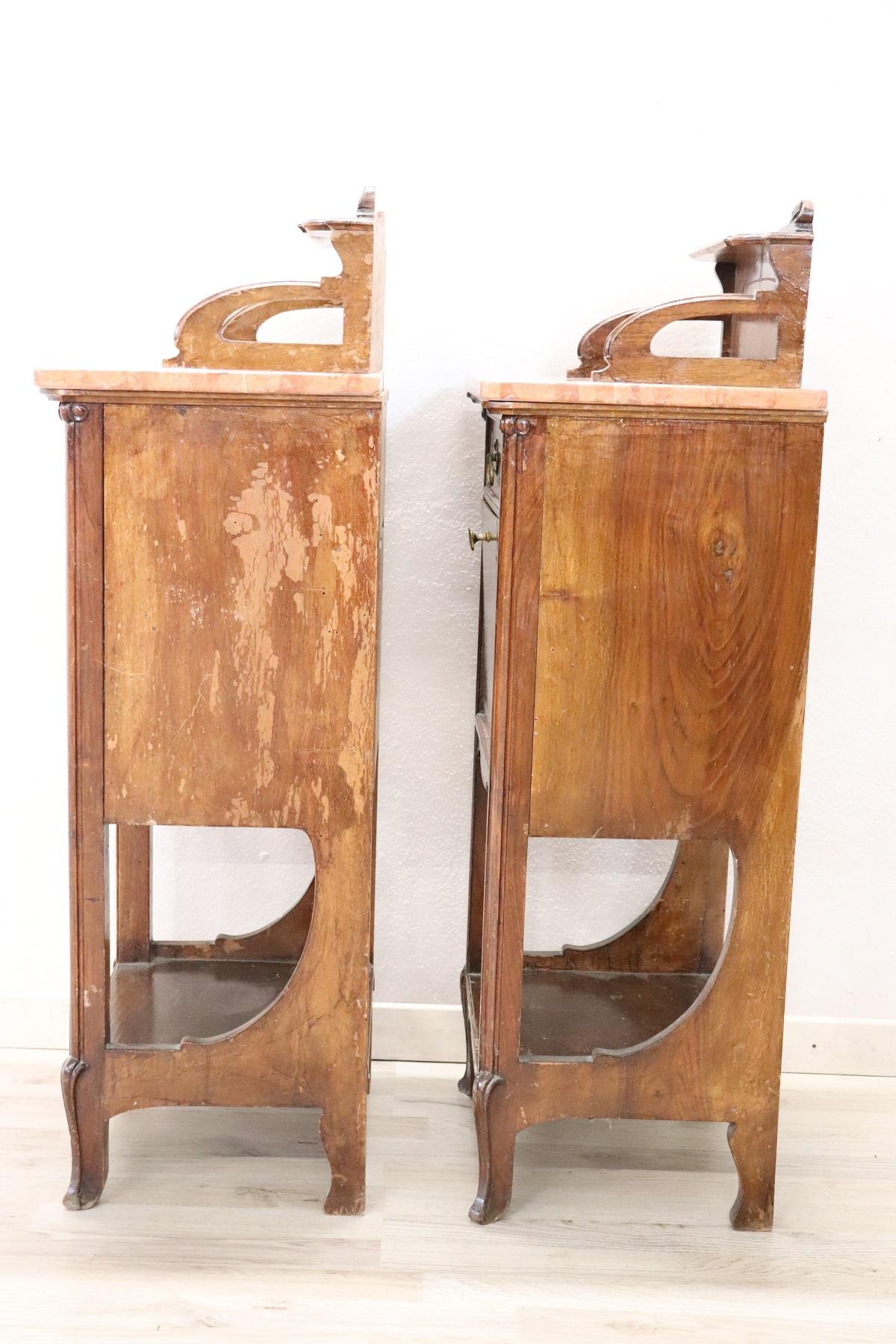 Rare and fine quality Italian Art Nouveau antique pair of nightstand, 1800s. The bedside tables are in precious walnut wood with a red marble top. The general line is moved as the Art Nouveau taste wanted. On the front, delicate floral decoration