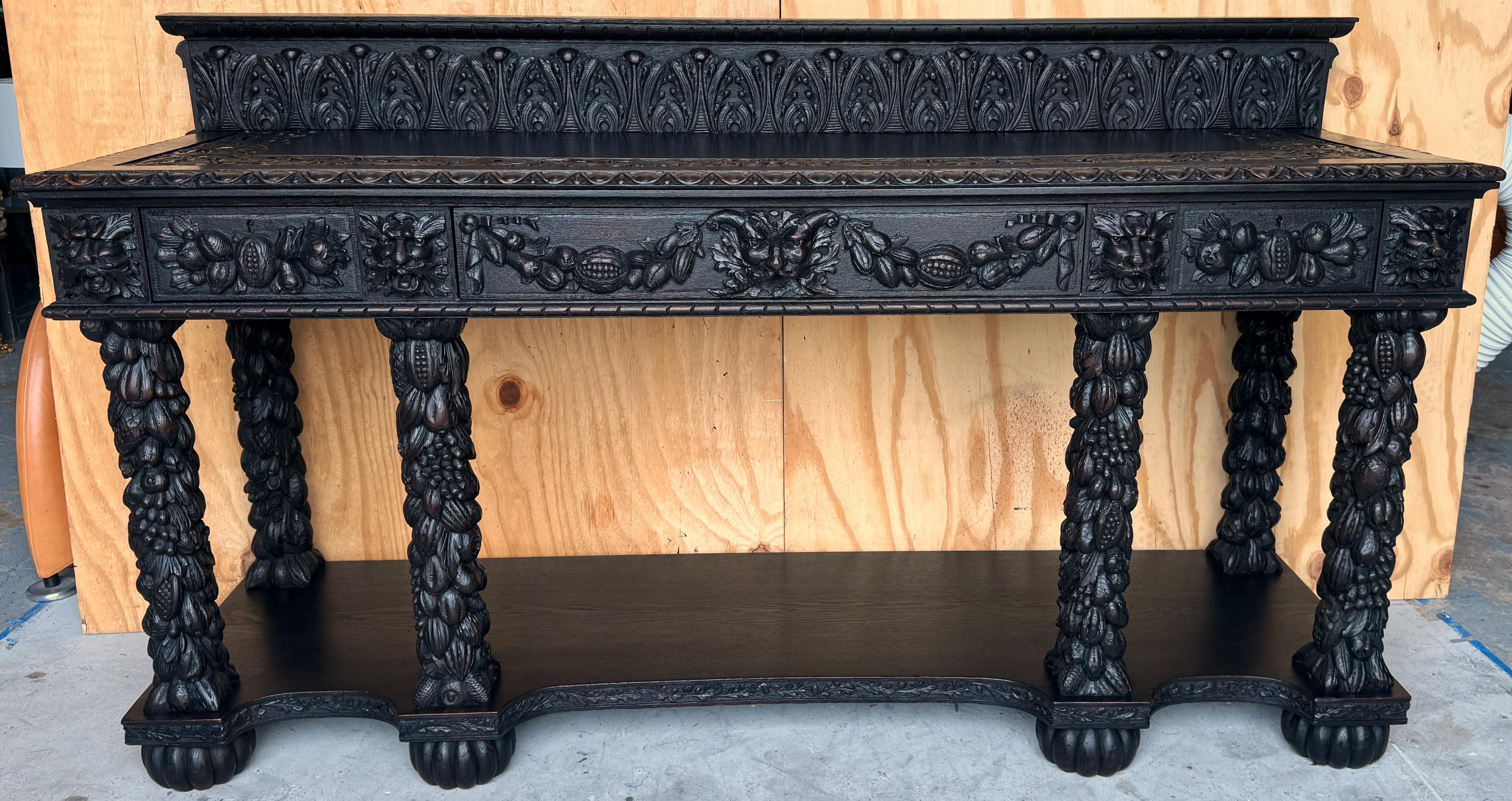 19th Century Italian Baroque/FFlorentine Carved Blackened Oak Hunt/Sideboard 

An exquisite 19th-century Italian Baroque/Florentine carved blackened oak hunt/sideboard is a masterwork of craftsmanship and design. With dimensions of 70 inches in