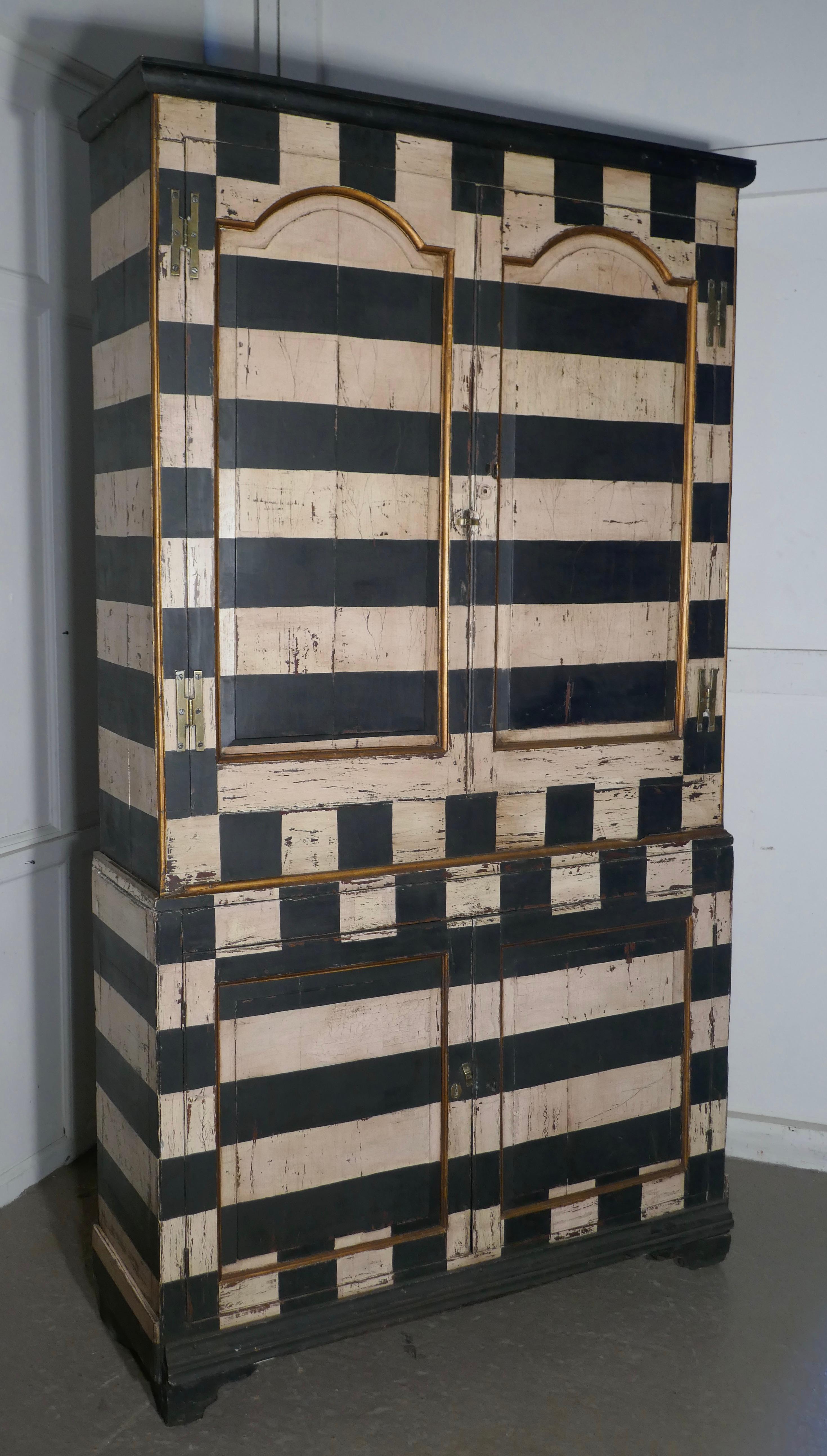 19th century Italian Baroque painted book case

This is a fantastic looking piece furniture it dates from the mid-19th century
The cupboard was painted in Italy in the Baroque style circa 1900, as was the fashion at this time
The paint is in