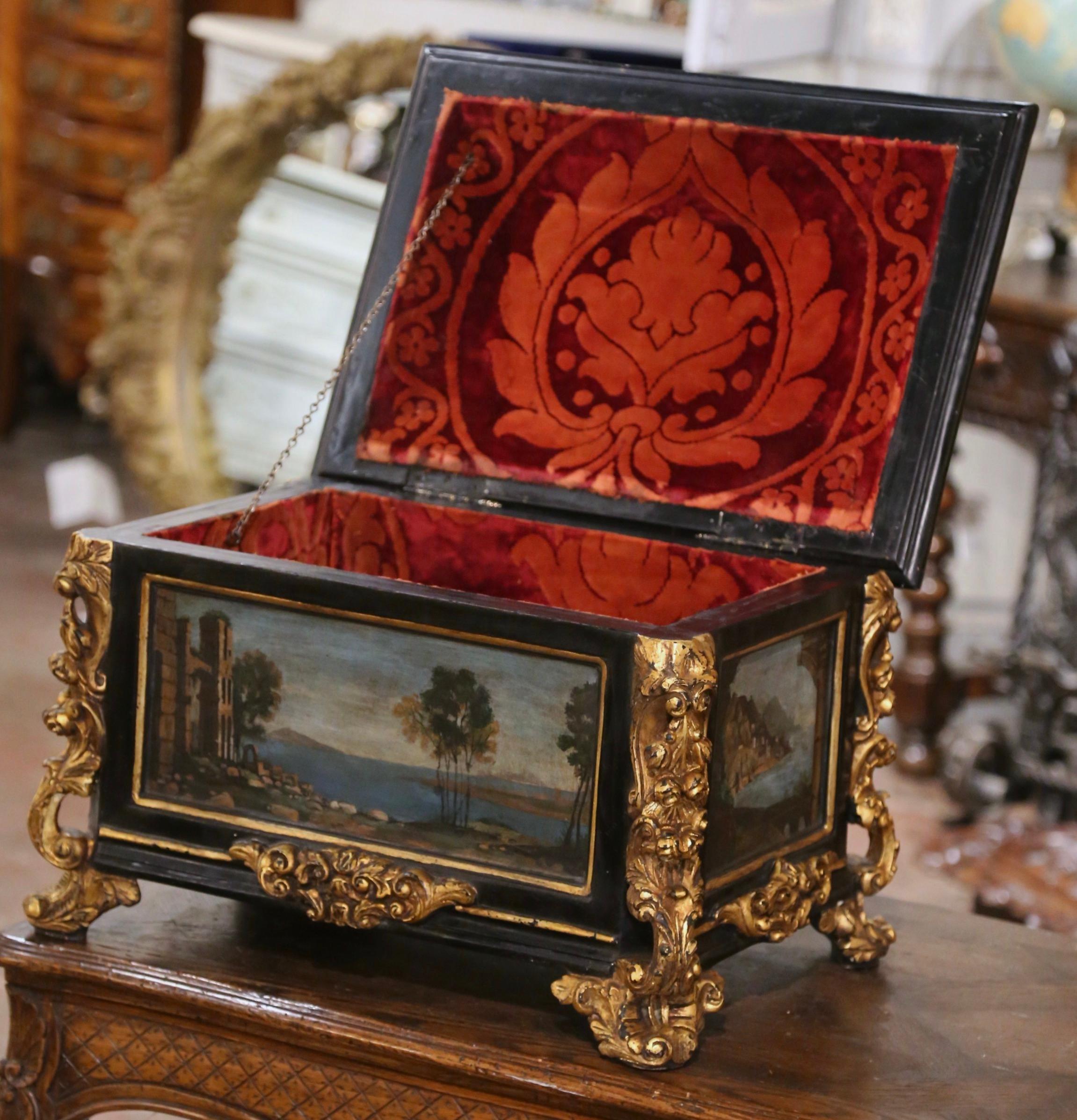 Decorate a coffee table or a shelf with this elegant and colorful casket. Crafted in Italy circa 1880, the Venetian box stands on heavily carved feet decorated with gilt acanthus leaf motifs, over a straight apron embellished with a center floral