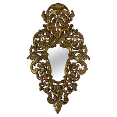 Espejo italiano del siglo XIX de madera dorada y tallada de estilo barroco