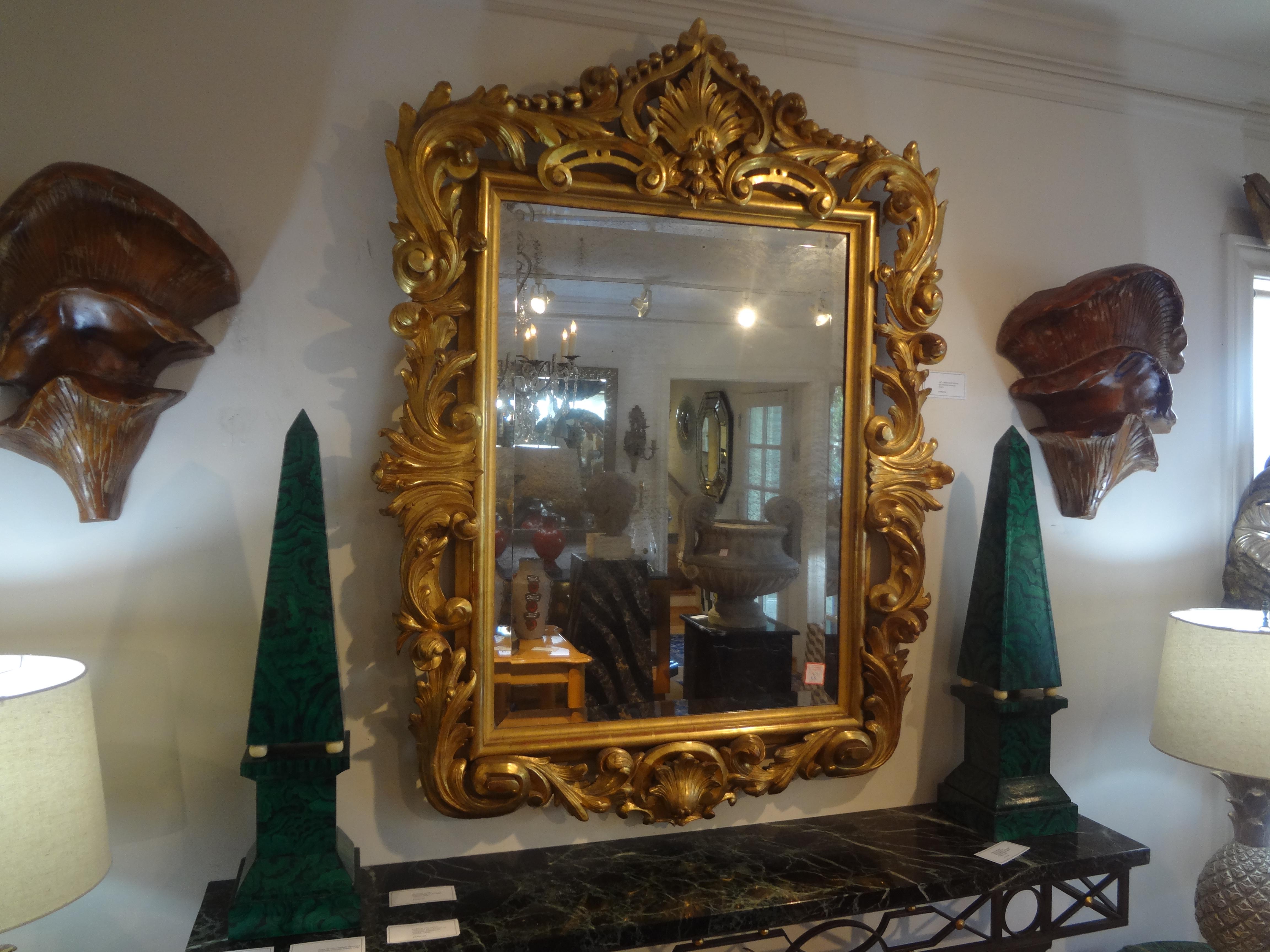 19th Century Italian Baroque Style Giltwood Mirror.
Our outstanding antique Italian Baroque style gilt wood beveled mirror retains the original mercury mirror and really makes a statement.
Stunning!