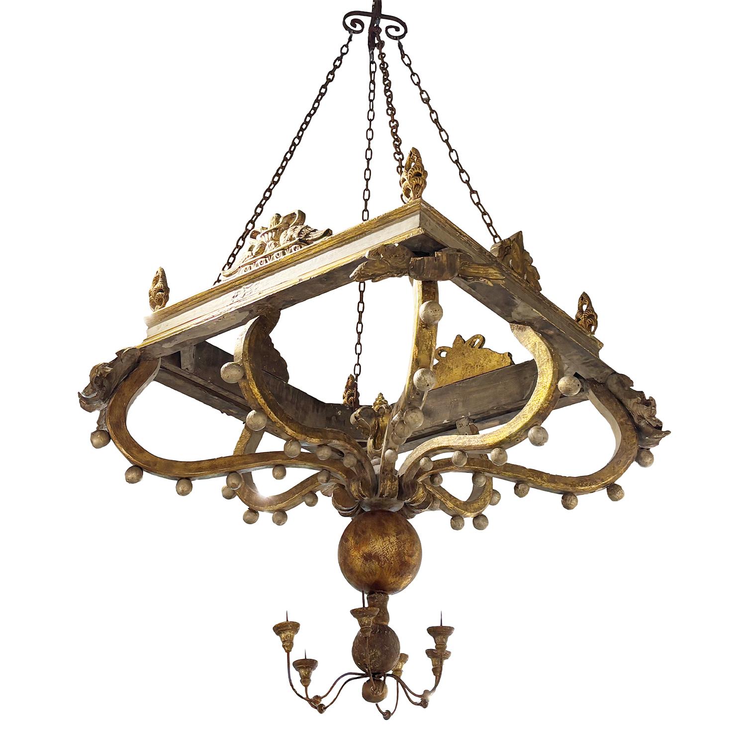 An early 19th Century, antique Italian square ceiling pendant, light fixture made of hand crafted Basswood, in good condition. The ornaments were assembled from a church and unified into this extra ordinary fixture. The objet d’ art originates from