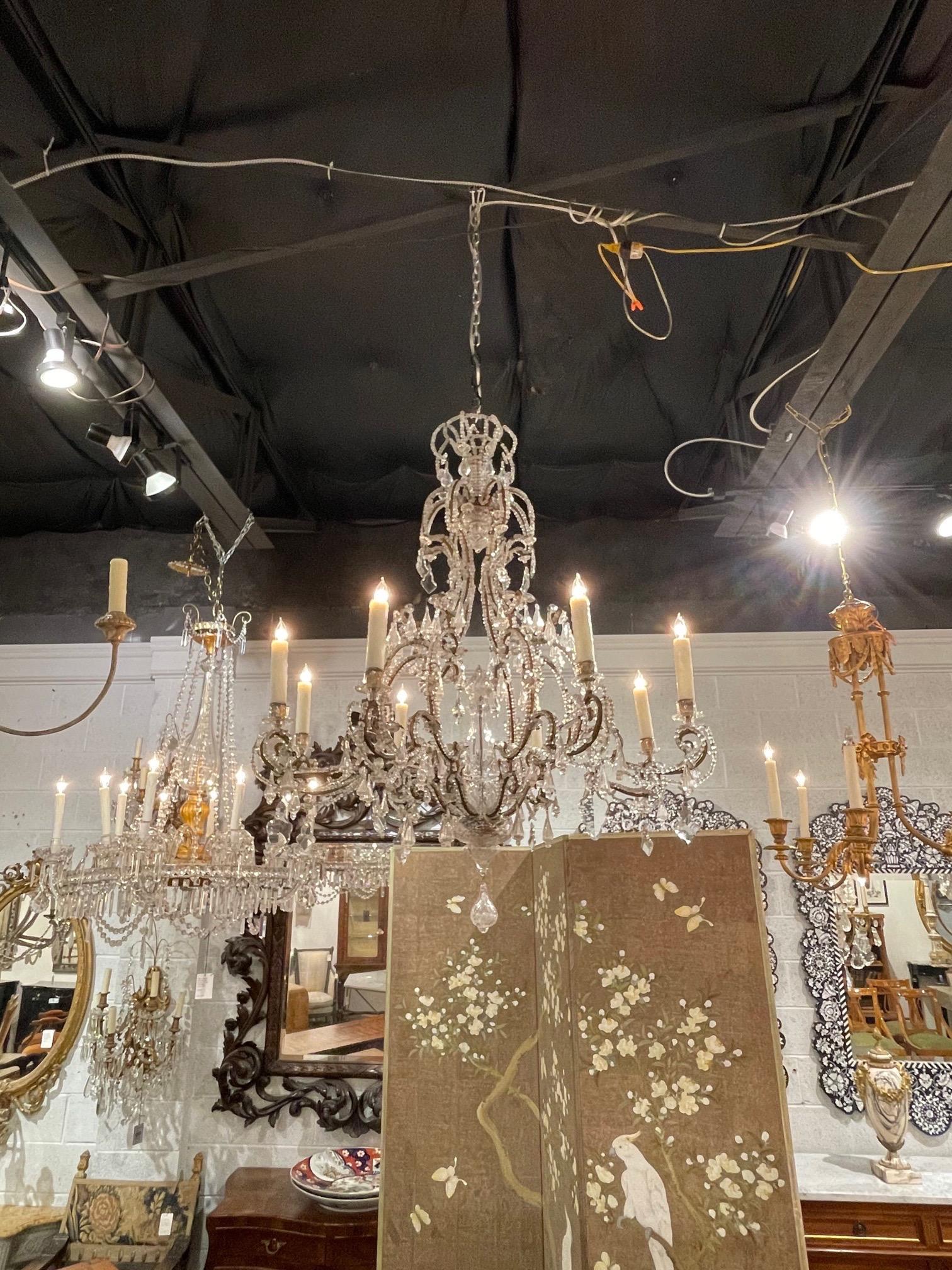 Gorgeous 19th century Italian beaded and crystal chandelier with 8 lights. The lovely curved base is covered in beads and there is multitude of dangling prisms. This sparkling beauty is very impressive!!