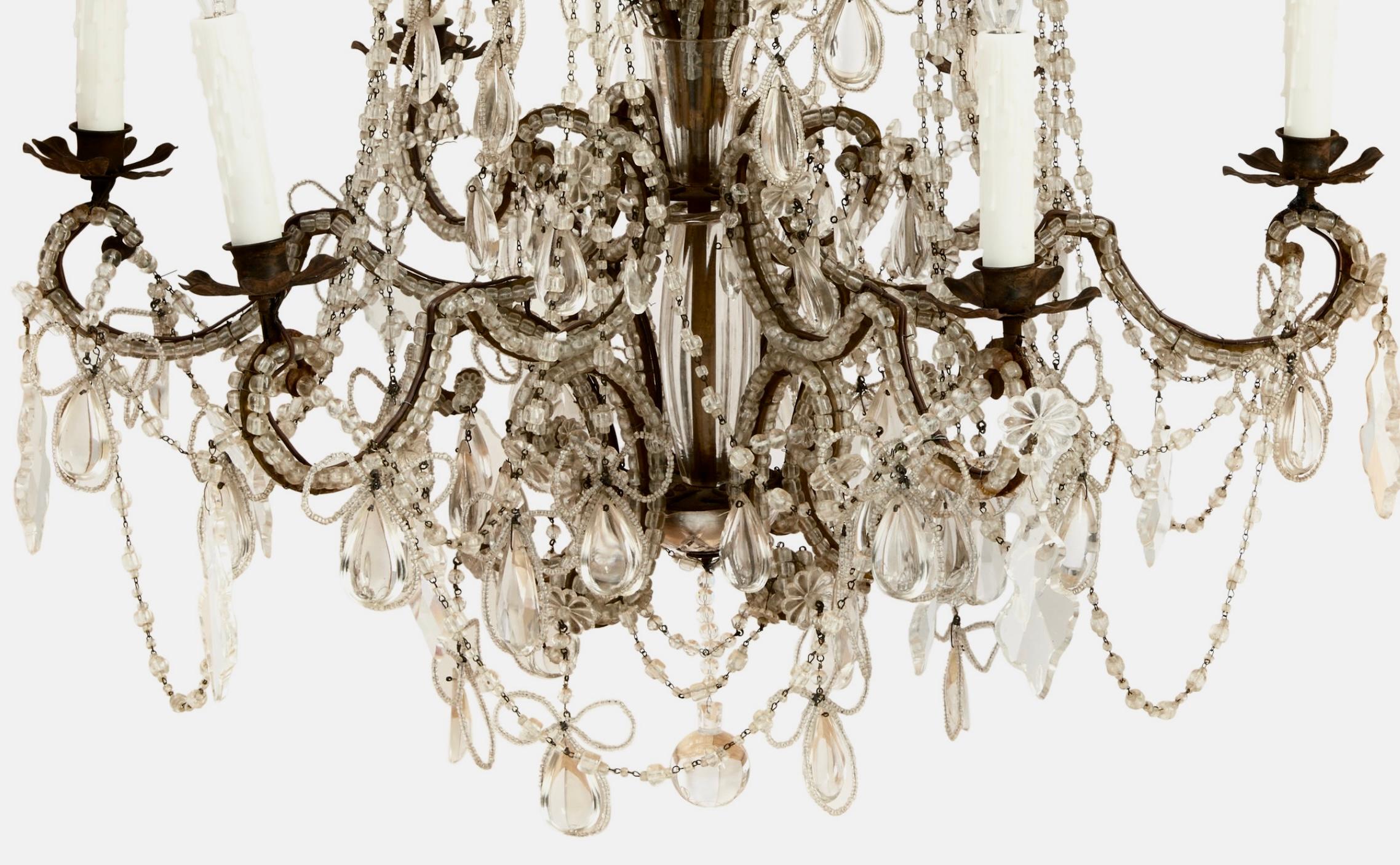Large and stunning 19th century Italian beaded and crystal chandelier with six (6) lights. The lovely, curved base is covered in beads among a multitude of dangling prisms, some in the shape of clover with beaded bows and ribbons throughout. This