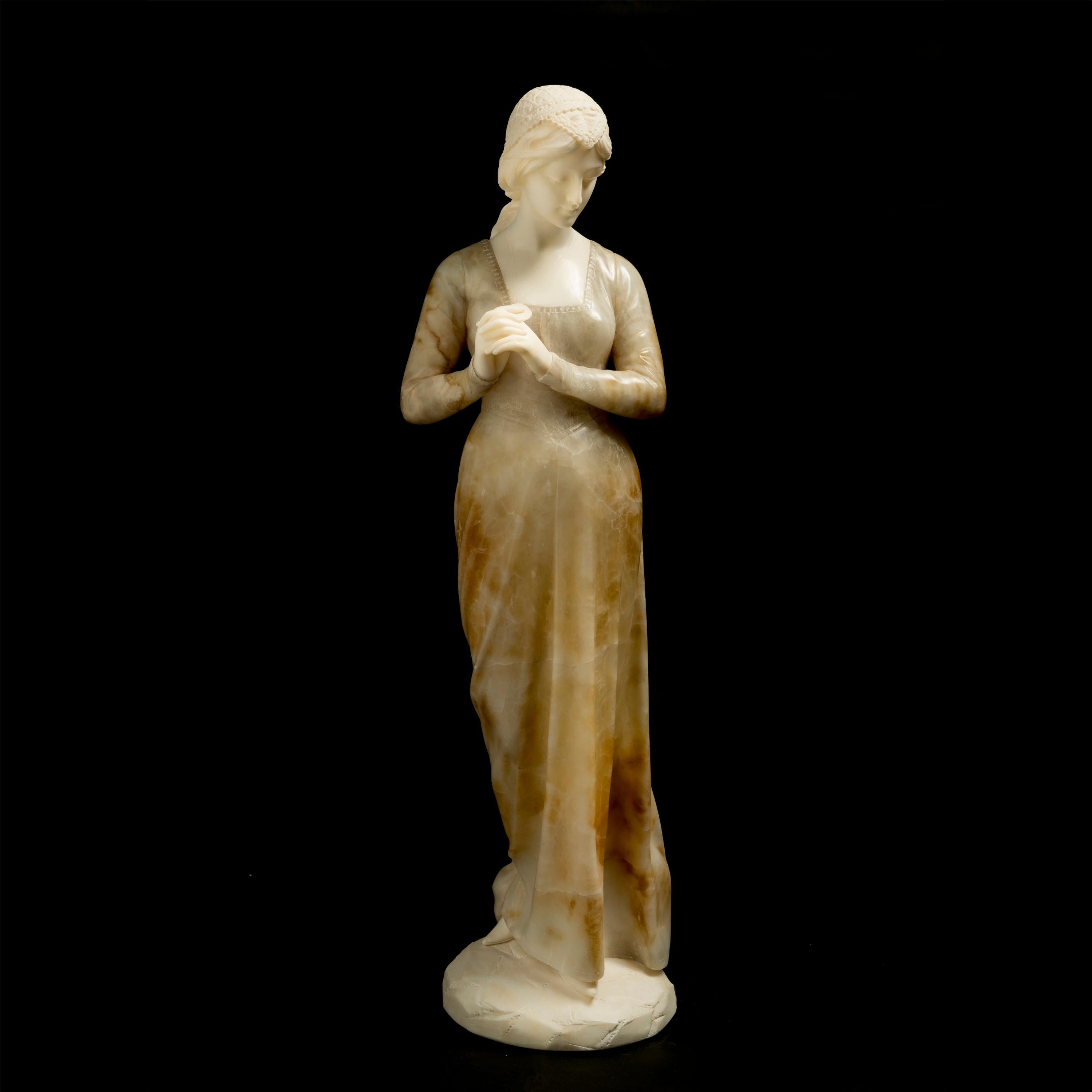 A Carved Alabaster Figure
By Emilio Fiaschi of Florence

This Italian alabaster sculpture by Fiaschi displays his skillful mastery by accentuating the grace of the female form through the subtle highlighting of the waistline. Meanwhile, juxtaposed
