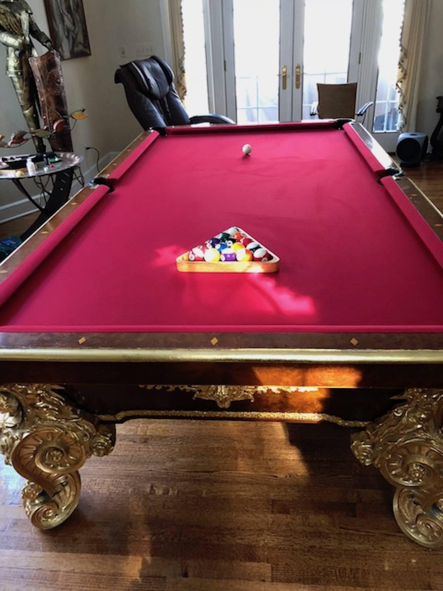 20th Century Italian burl wood, mother-of-pearl inlay, gilt bronze legs and body. Slate 9 ft x 5 ft custom table. New felt and pool balls. Magnificent one of a kind centre piece!