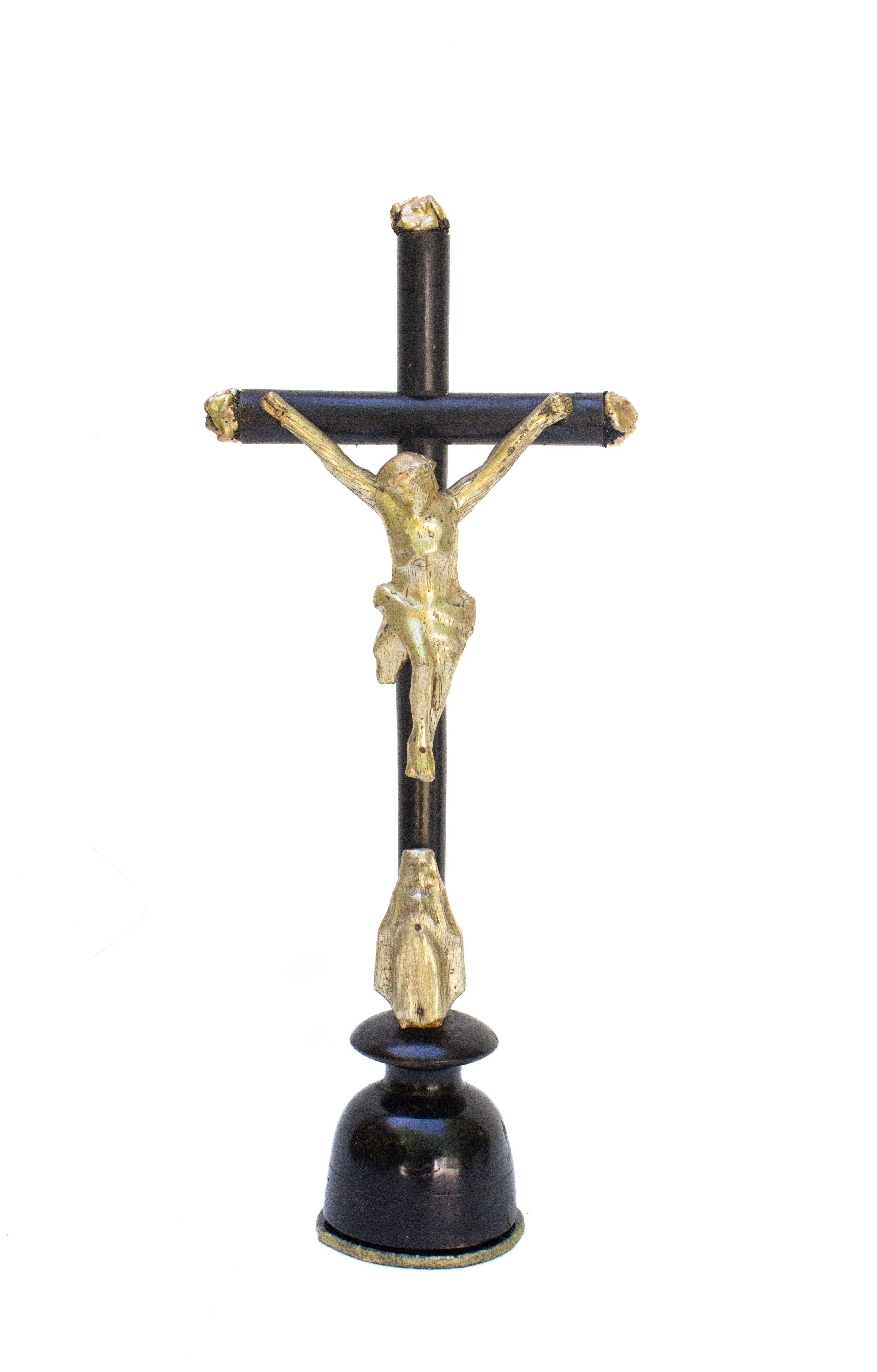 19th century Italian black crucifix with a gold and pearlescent figure of Christ and Mary. It is adorned with baroque pearls and mounted on an agate slice. This figure of Christ is unique as it depicts Mary below Christ which is uncommon among