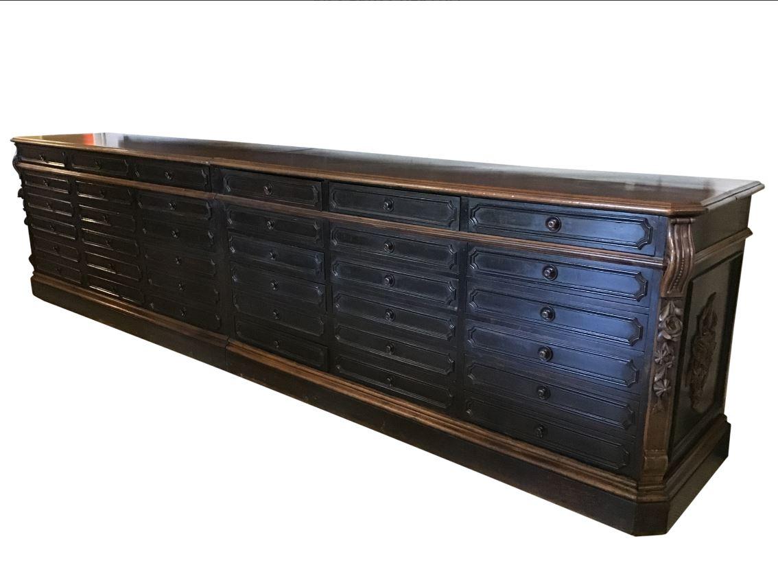 19th century Italian black coated wooden counter with drawers and walnut top, 1890s.