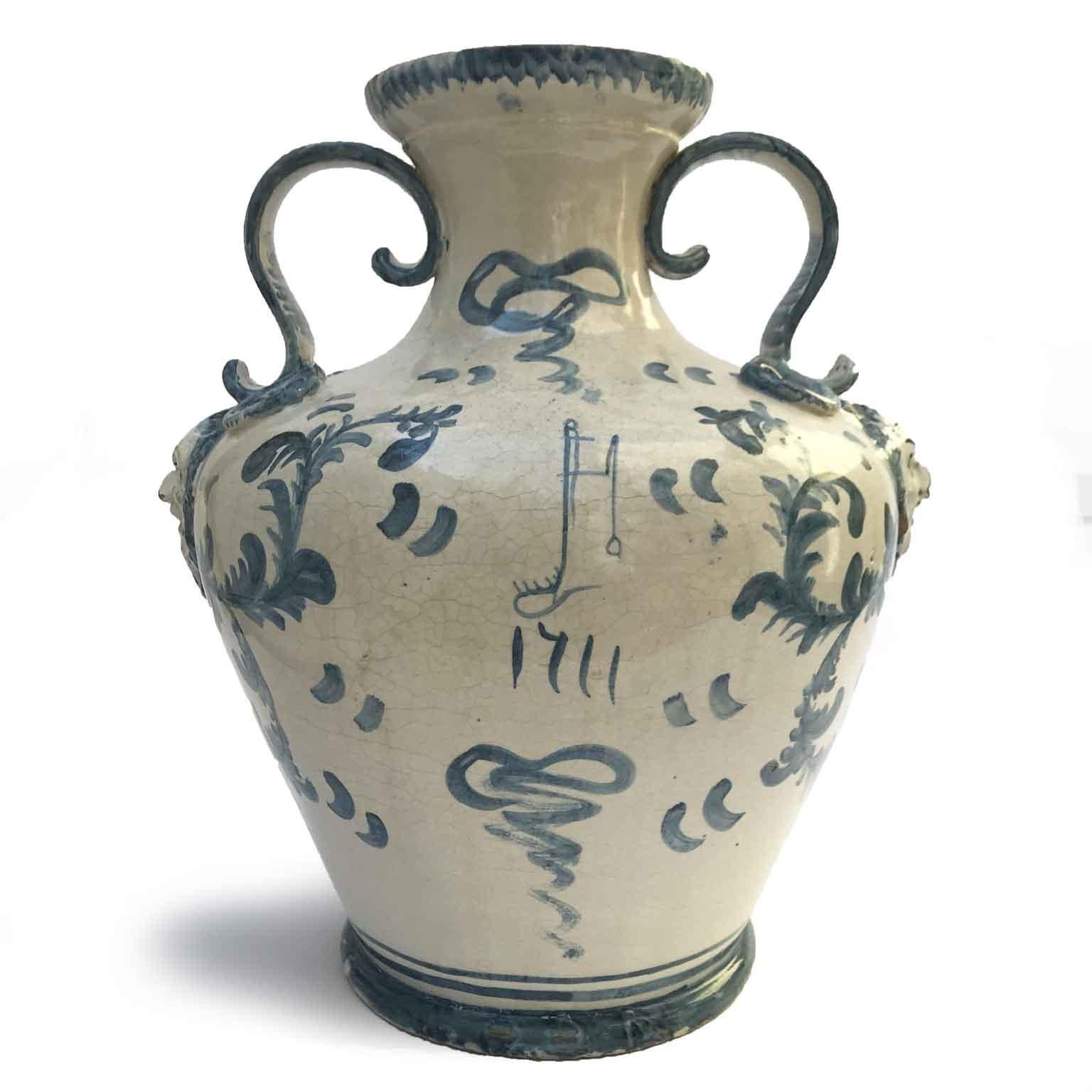 19th Century Italian Savona Maiolica handled Amphora Vase  with masks and Blue Decoration. Unmarked this circular blue and white antique vase is an Italian Ligurian manufacture from Savona. Good age related condition, minor defects.
Mid 19th century