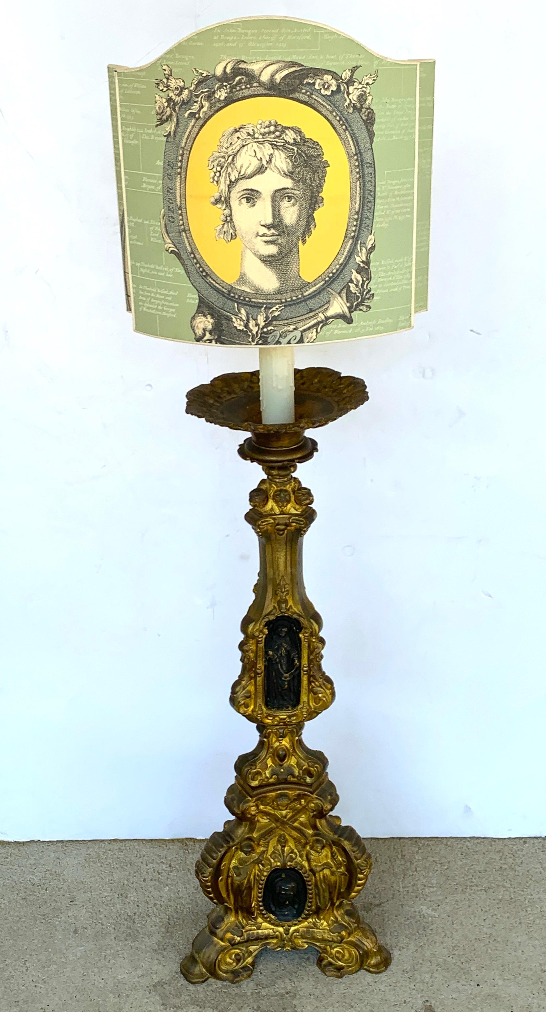 19th Century Italian Bronze Altar Candlestick, Custom Shade, Now Electrified

A 19th-century Italian bronze altar candlestick is now elegantly transformed into a lamp with a custom shade and electrification. This finely cast piece features gilt