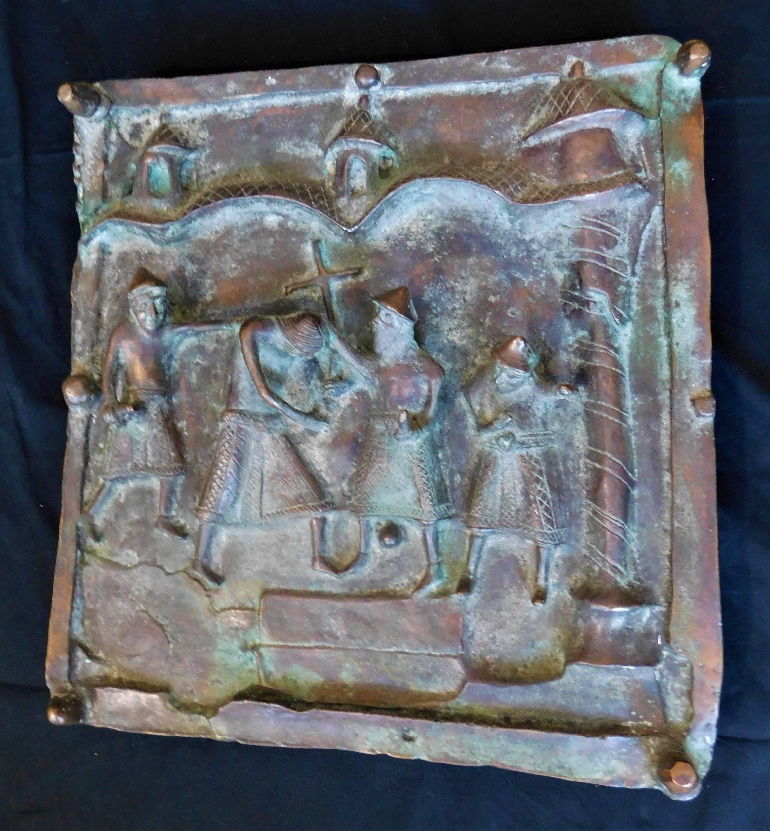 This 19th century Italian bronze panel is a section from a church door in Italy. This religious icon is a depiction of the 