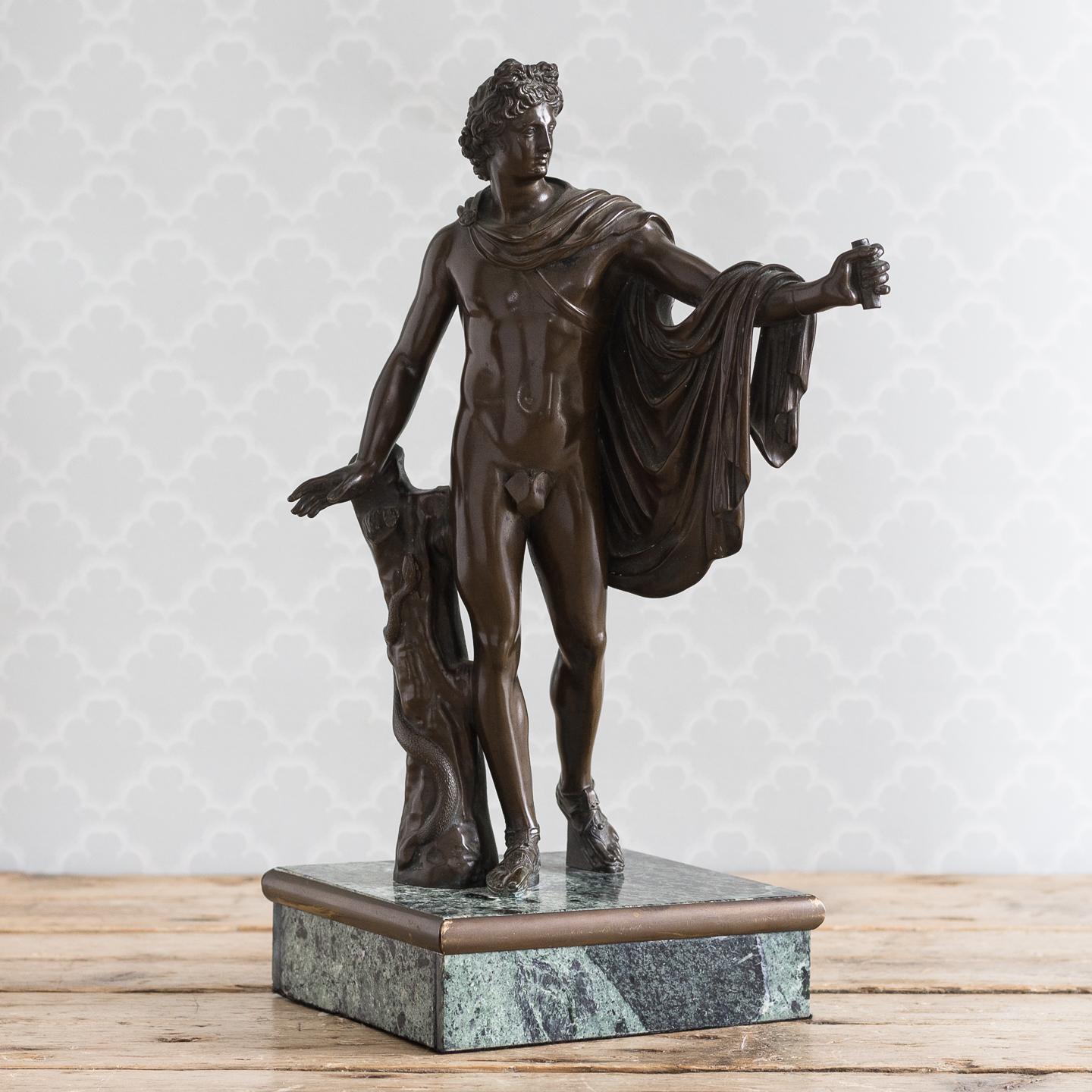 A 19th century Italian bronze of ‘The Apollo Belvedere’, set on Verde Antico plinth base, lacking quiver.