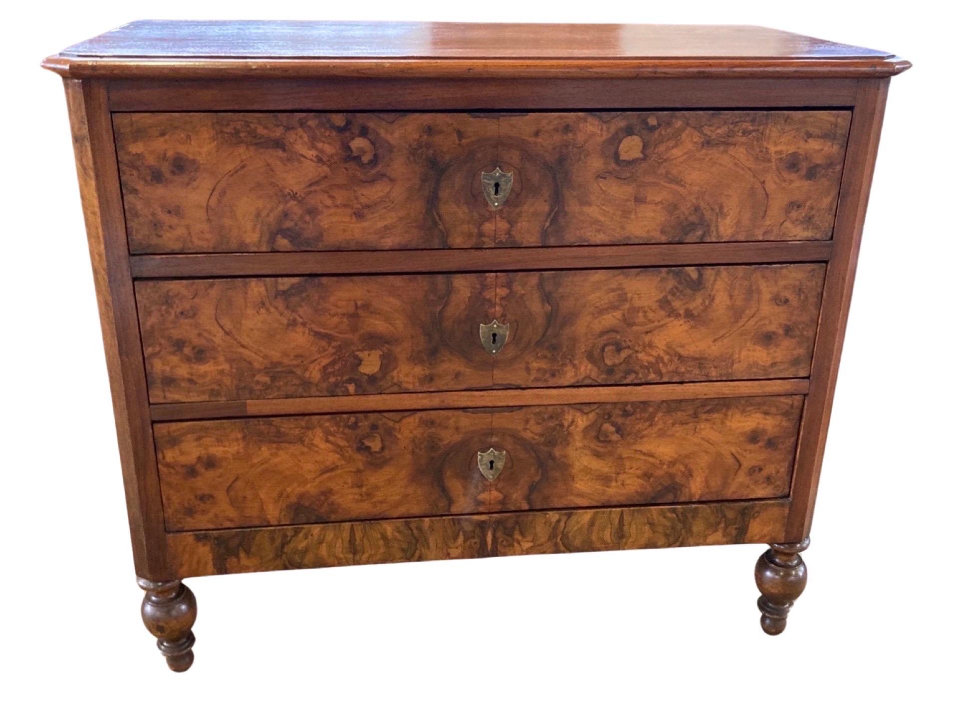 Charles X commode crafted in central Italy in the early 1800s using walnut. This is a beautifully simple commode with straight lines and great proportions. The commode features three inset drawers with beautiful hand-made dovetail joints and drawer