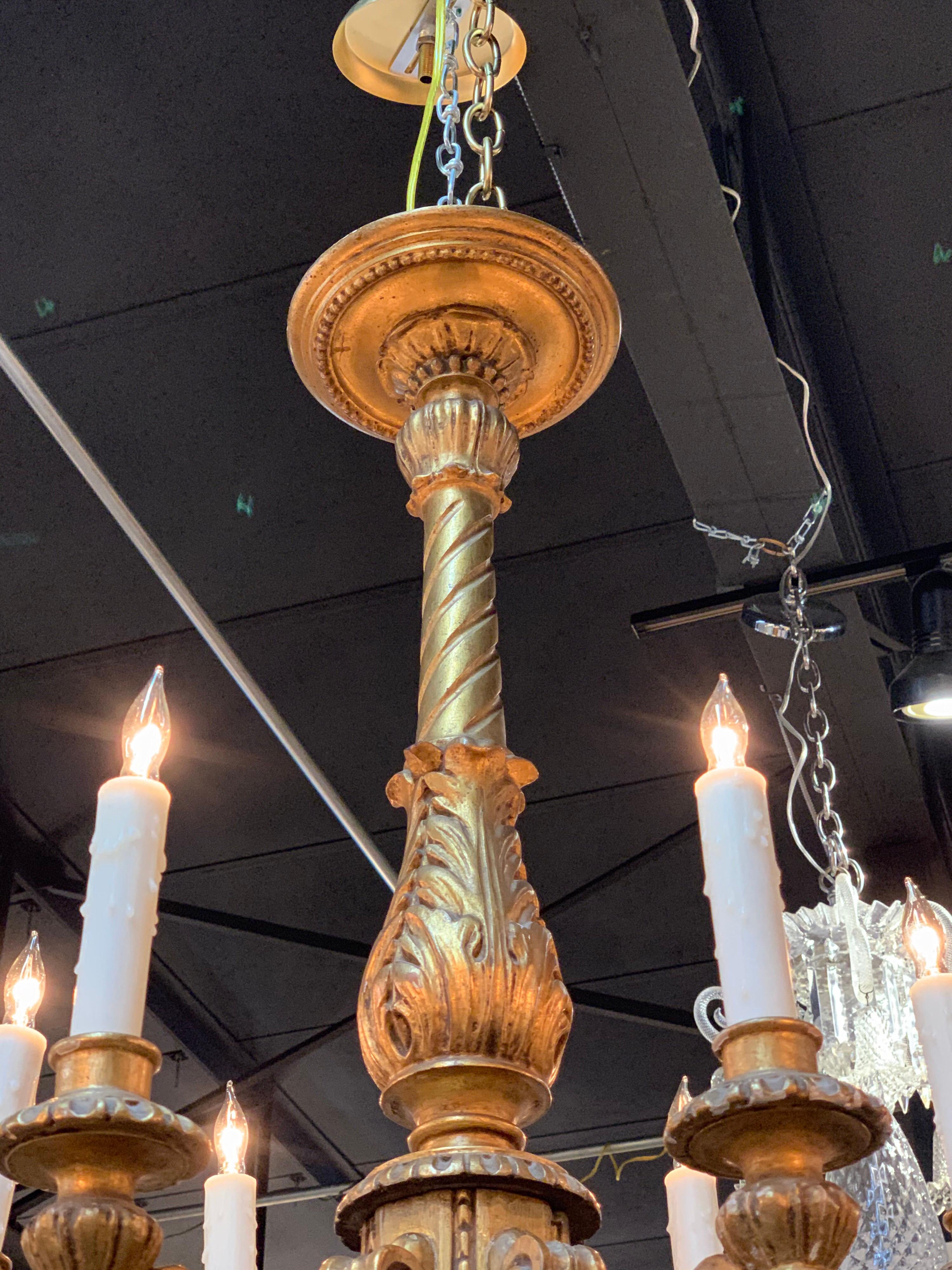Very fine 19th century Italian and giltwood 12-light chandelier. Beautifully carved and high quality gilt finish. An exceptional fixture that creates a truly elegant look!