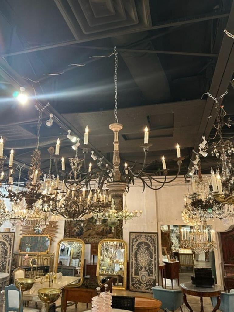 Handsome 19th century Italian carved and parcel gilt 8 arm chandeliers. Very nice patina and great scale and shape as well. Lovely! Note: Price listed is for one. 