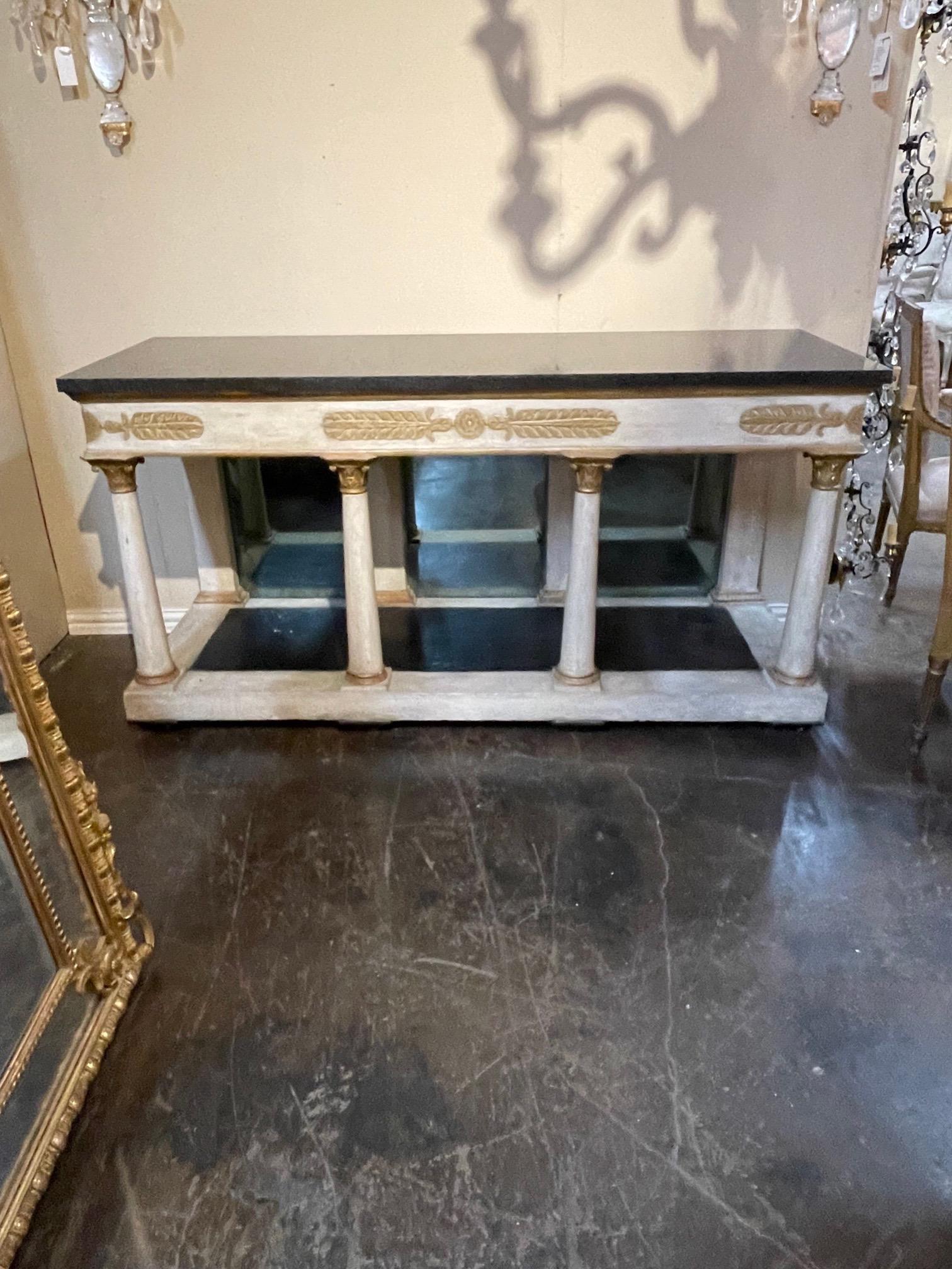 Very fine 19th century Italian carved and parcel gilt console with black marble top. Nice patina along with pretty clean lines. Great for a variety of decors!